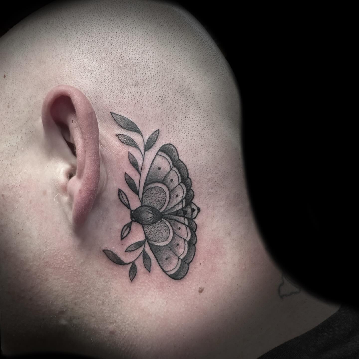 Butterfly black and grey tattoo on the neck by Kelsea Weir McCree
