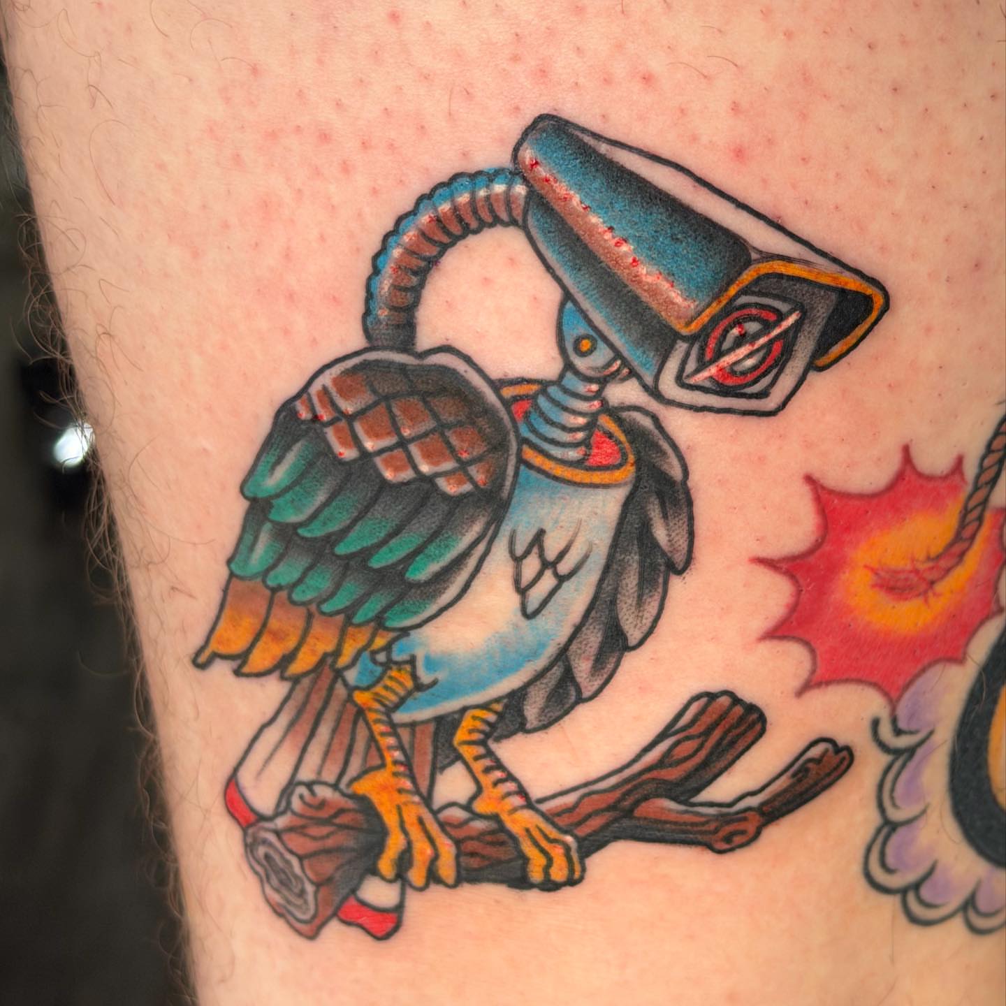 Robotic bird American traditional tattoo on the thigh by Skoty Fox