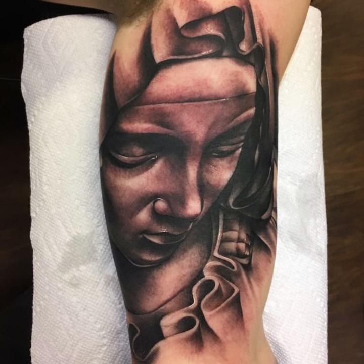 Woman's face realism tattoo on the forearm by Keith (KAM) Miller