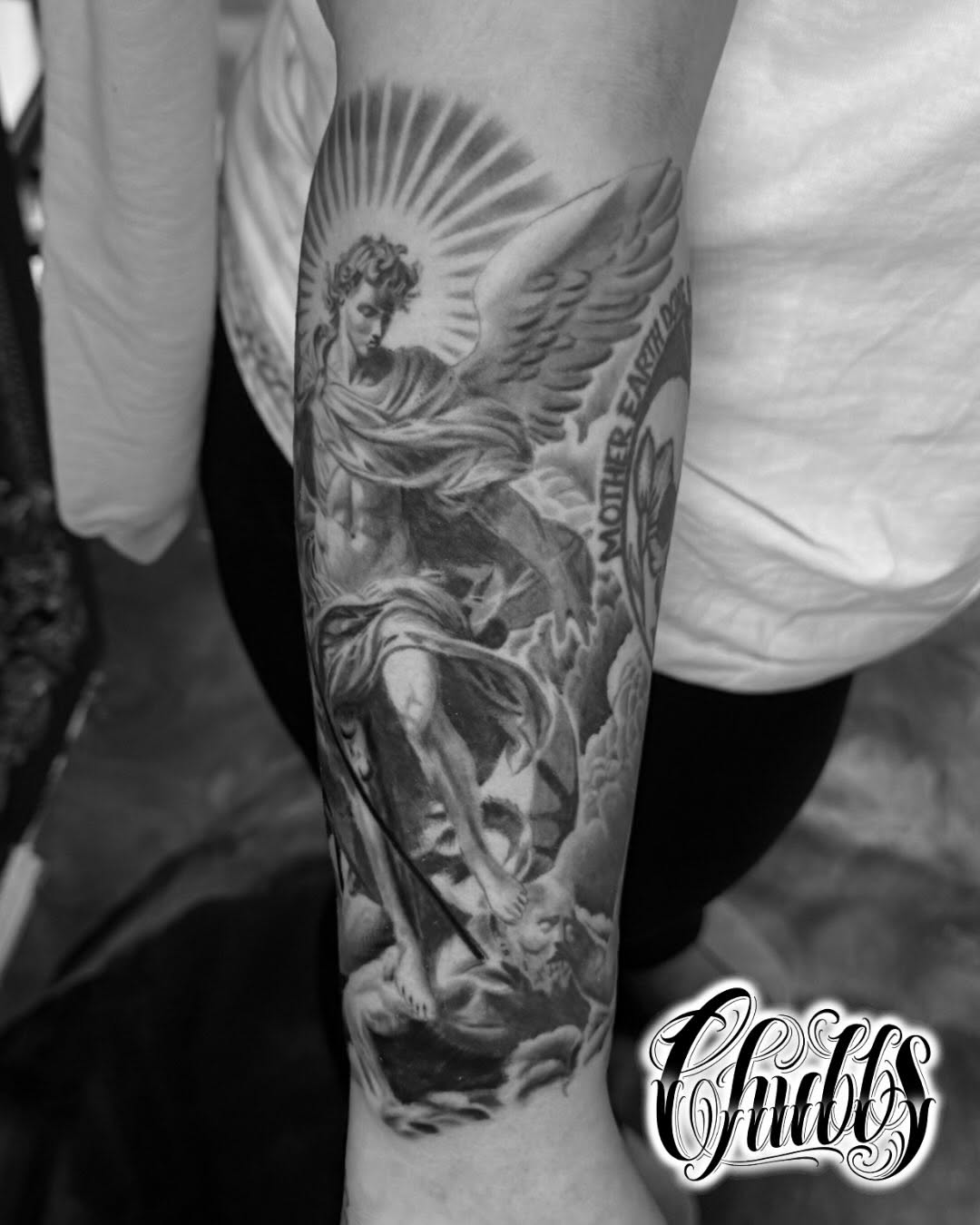 Angel with halo and clouds realism tattoo on the forearm by Chubbs
