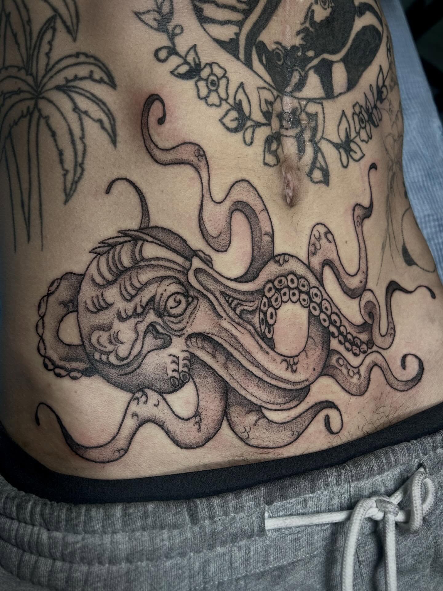 Octopus black and grey tattoo on the torso by Bria🩸