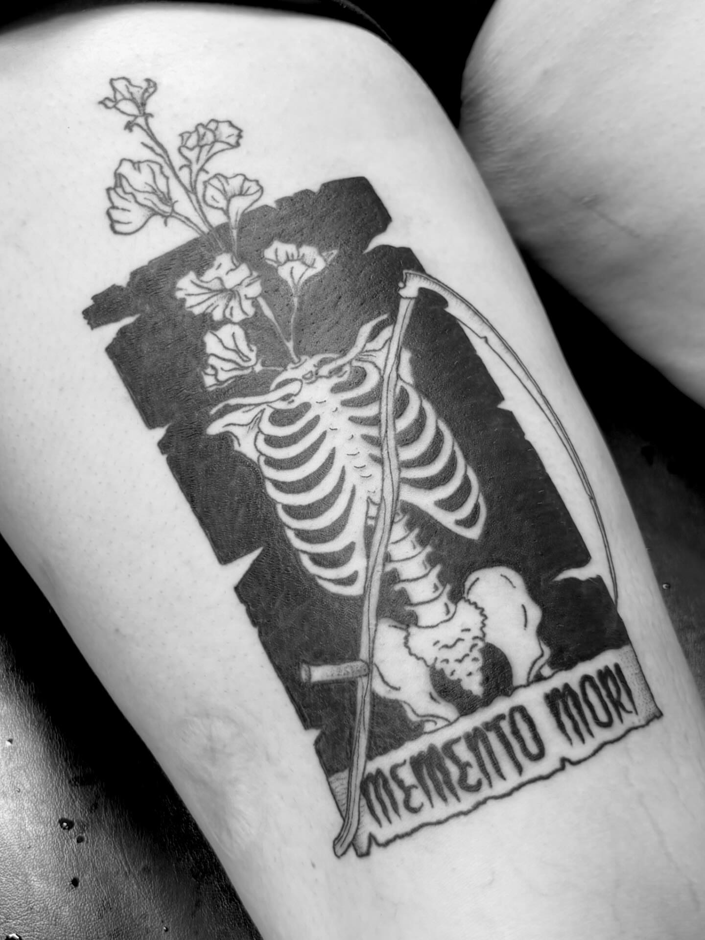 Skeleton with scythe black and grey tattoo on the thigh by Bryan Black