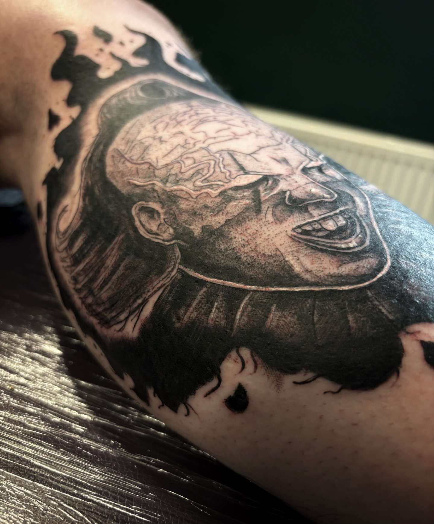 Tattoo by @scorchedbones_ — black_and_grey, realism