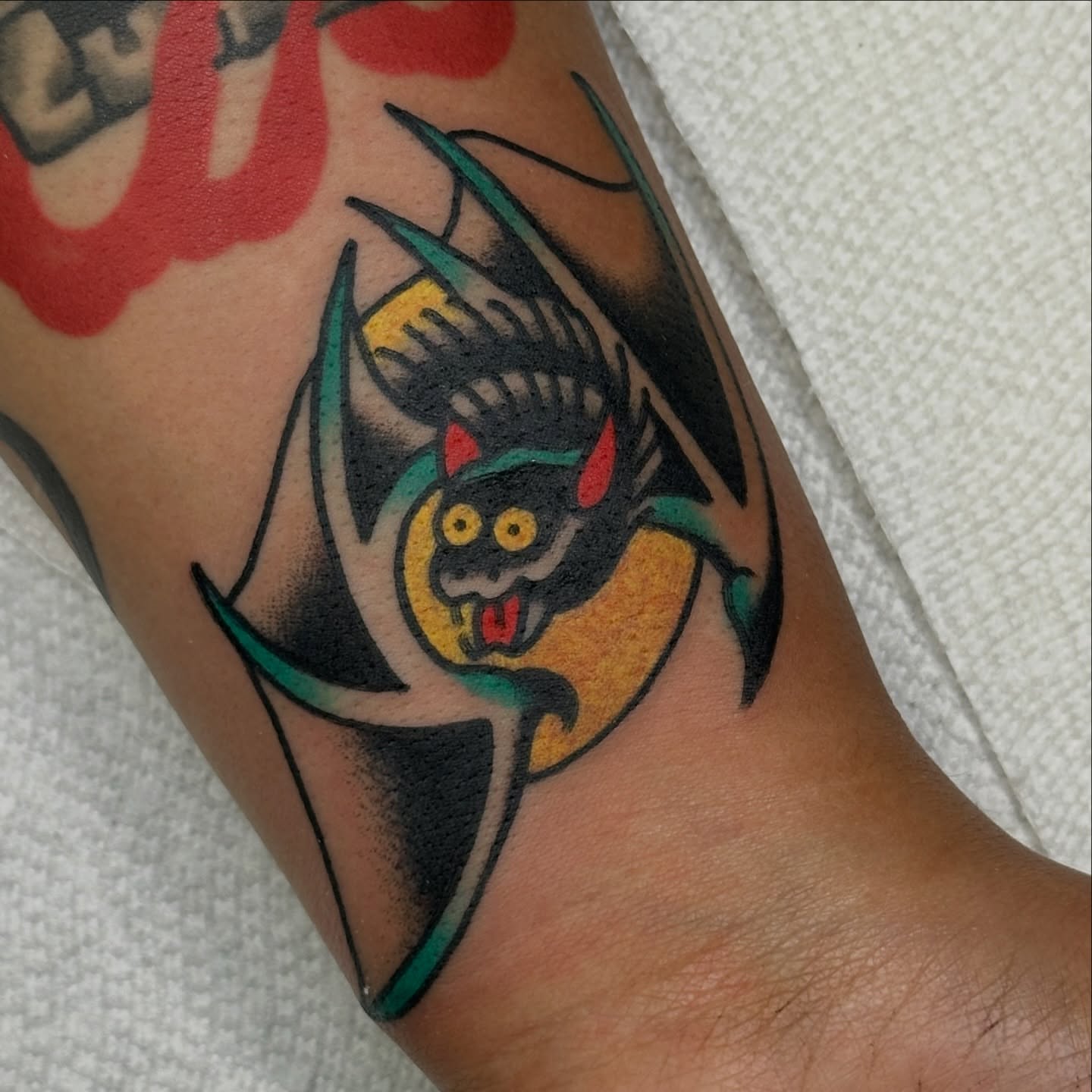Bat American traditional tattoo on the forearm by Amanda Bonhomme, Las Vegas, Nevada