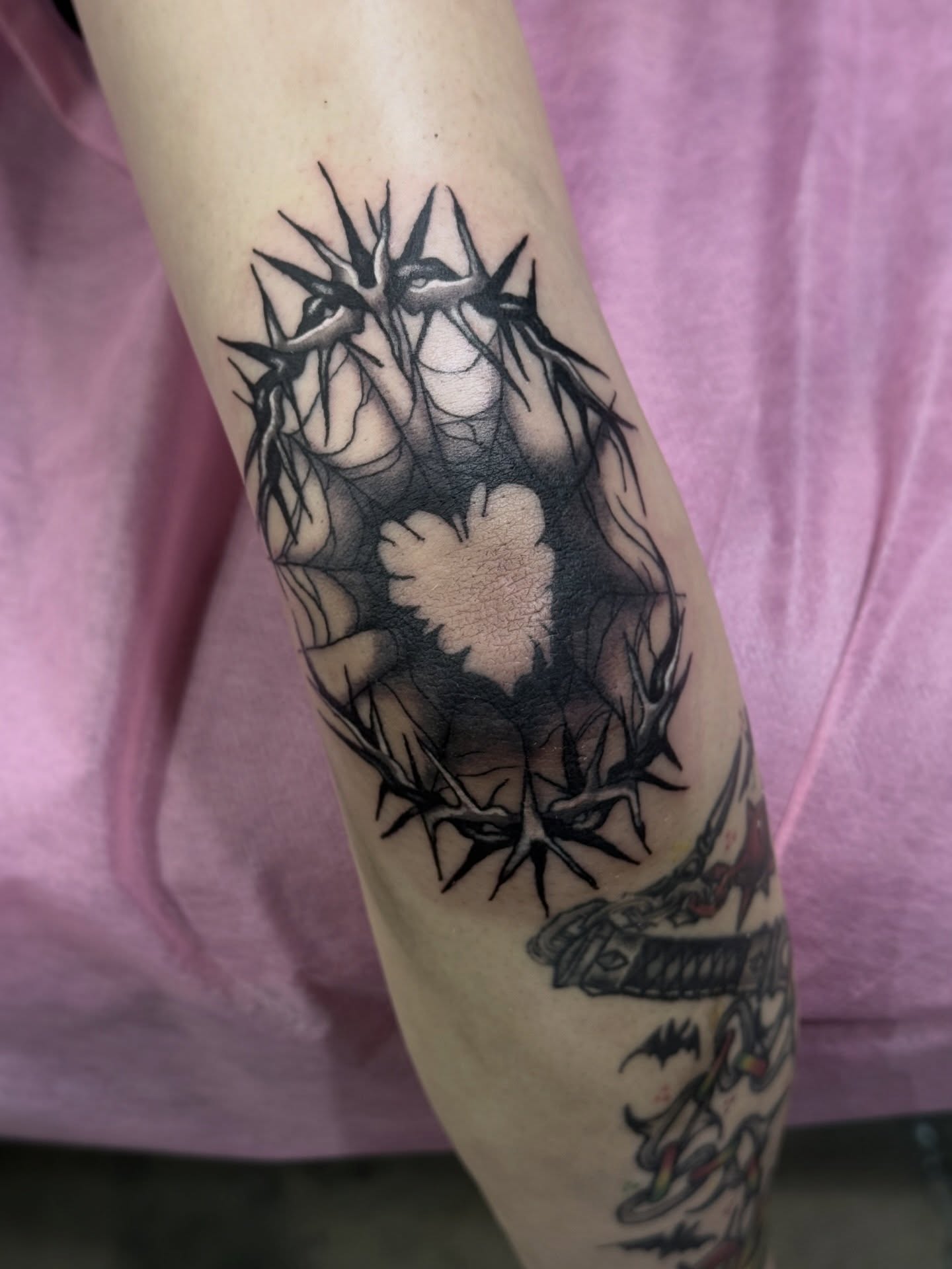 Crown of thorns black and grey tattoo on the forearm by Alexandra Fische