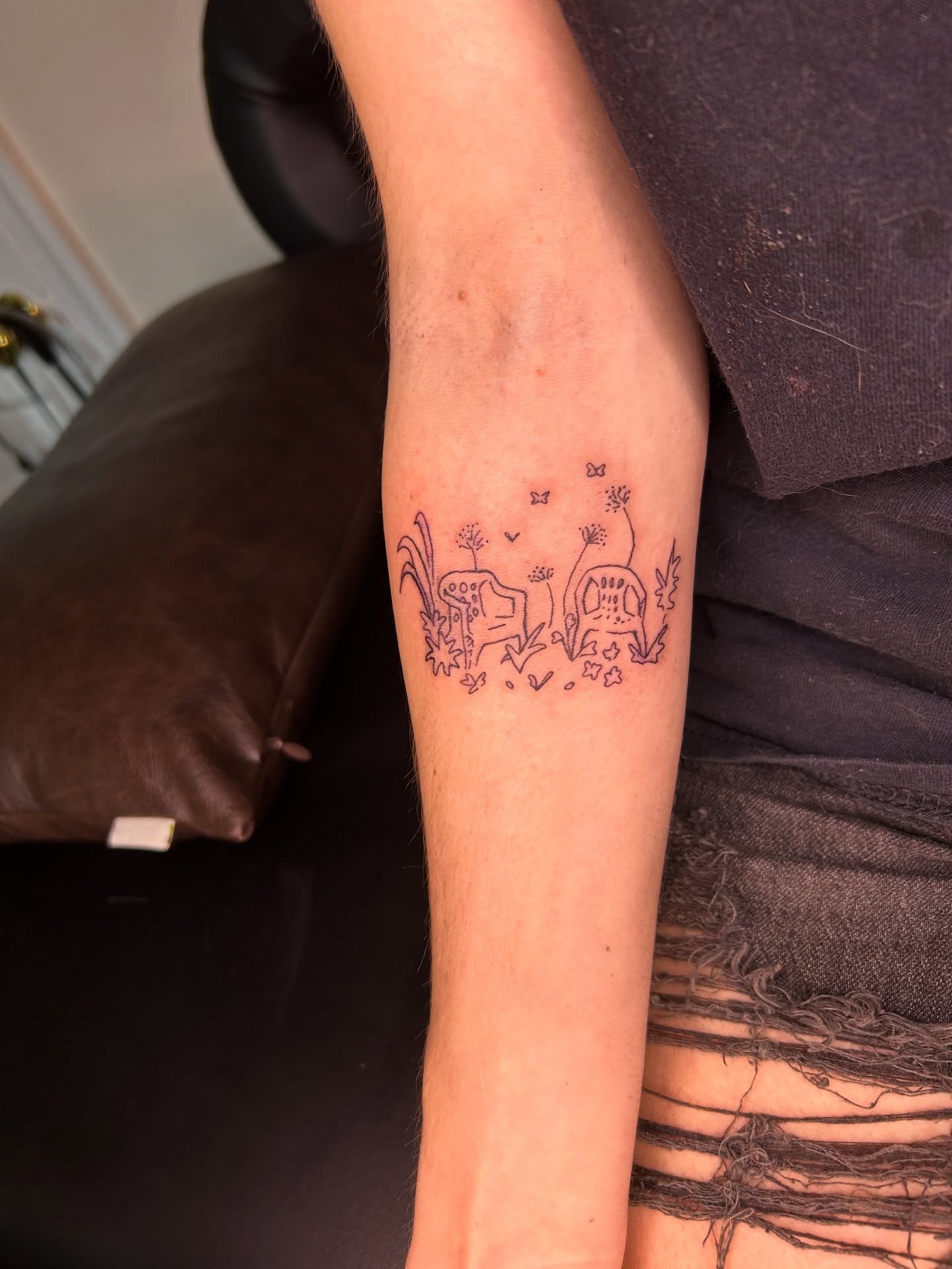 Gnome and flowers dotwork tattoo on the forearm by Mattie Robinson