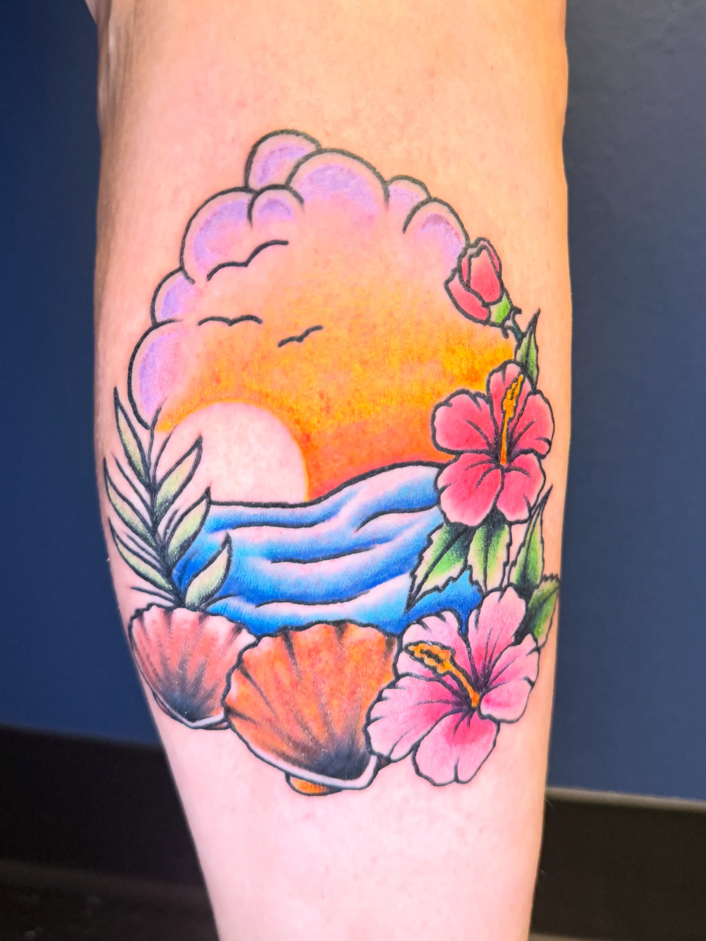 Sunset with flowers and shells new school tattoo on the forearm by Maggie De La Torre ๐ณ๏ธโโง๏ธ๐ฒ๐ฝ