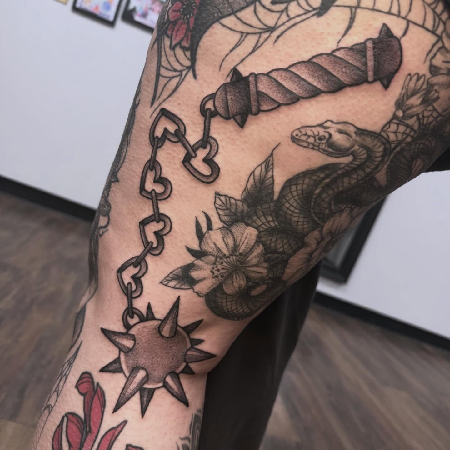 Snake and dagger American traditional tattoo on the forearm by Sarah Foltz