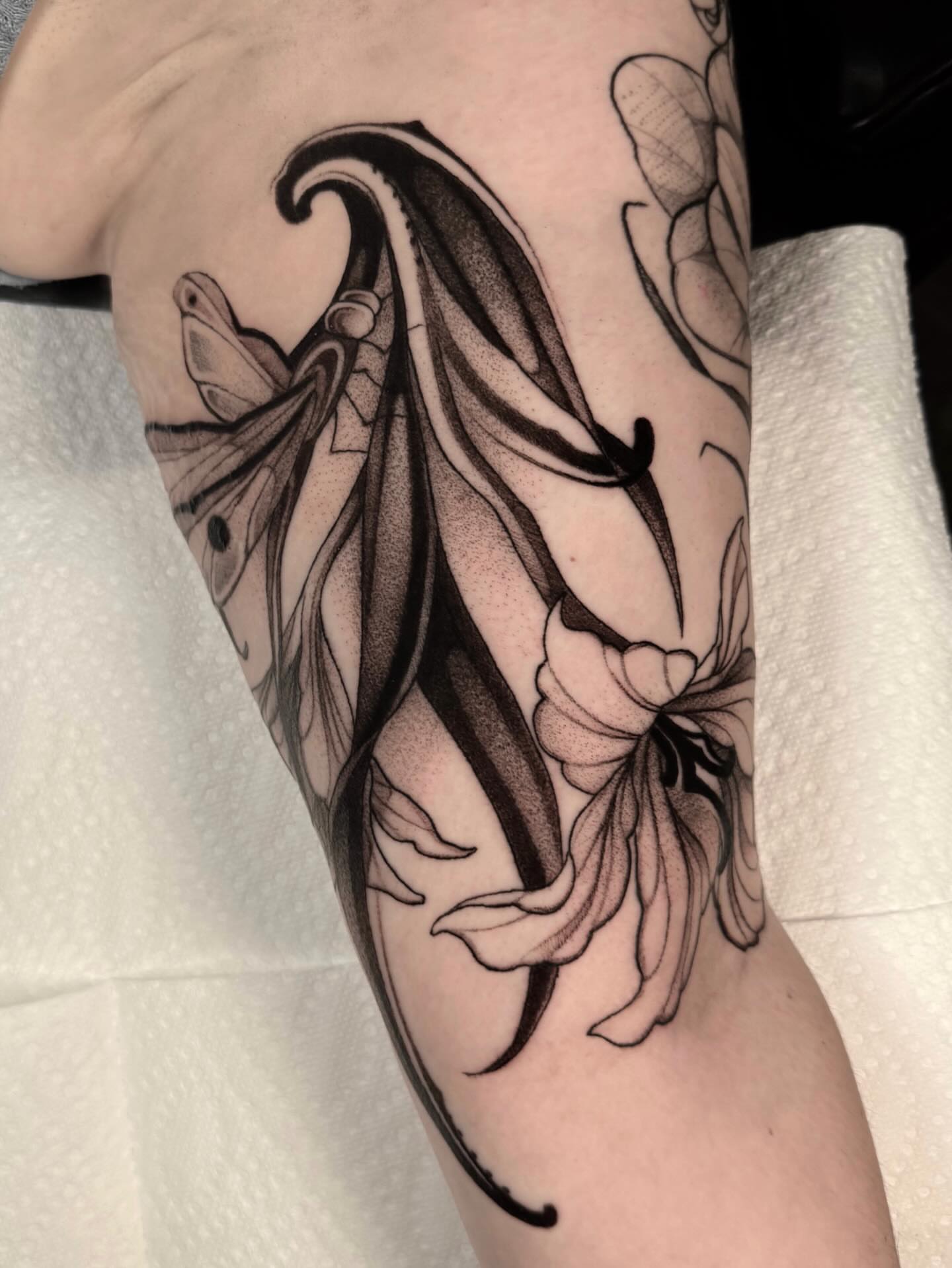 Floral design dotwork tattoo on the forearm by jada