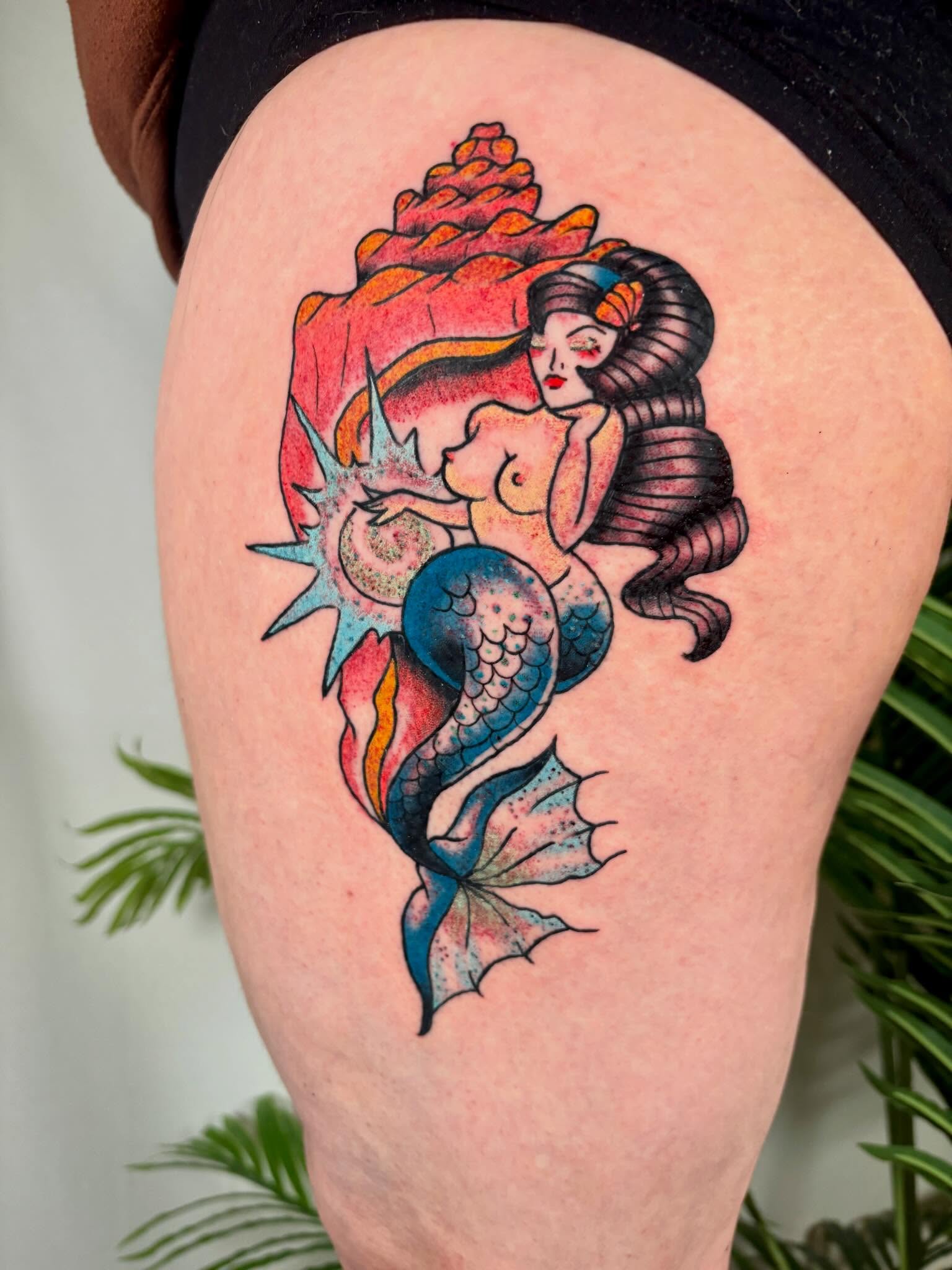 Mermaid illustrative tattoo on the thigh by Davie Tattoos