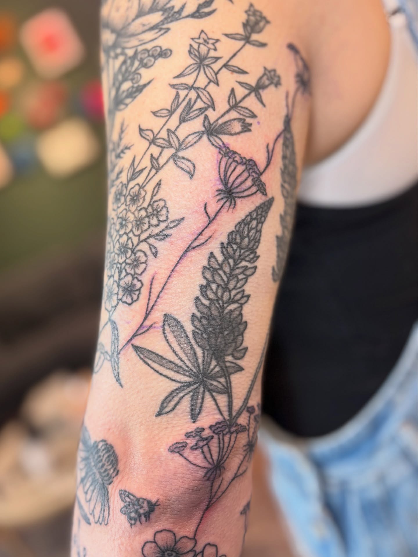 Botanical black and grey tattoo on the forearm by Meg Ingersoll