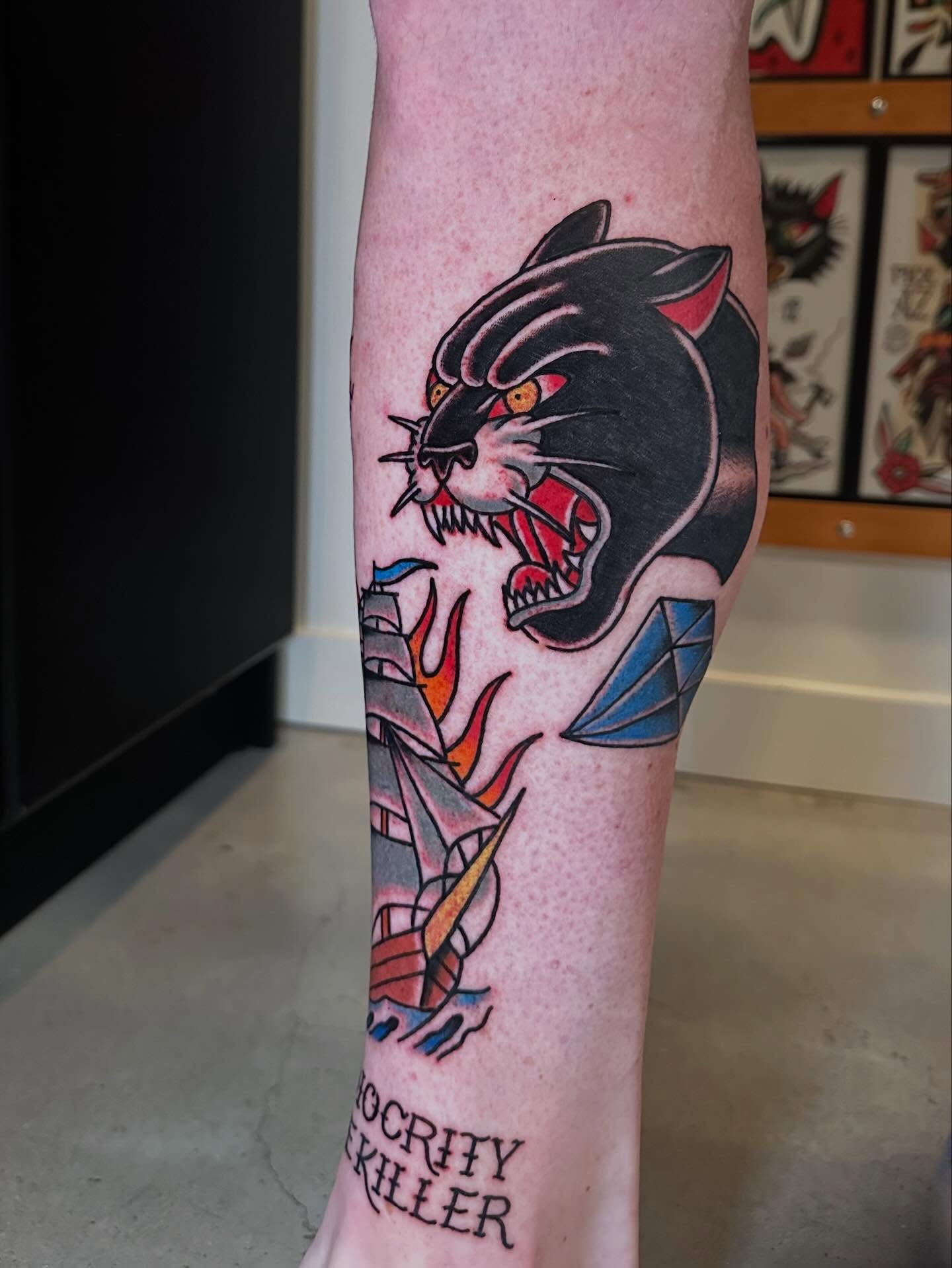 Panther American traditional tattoo on the forearm by Whitney Creep Tattoos