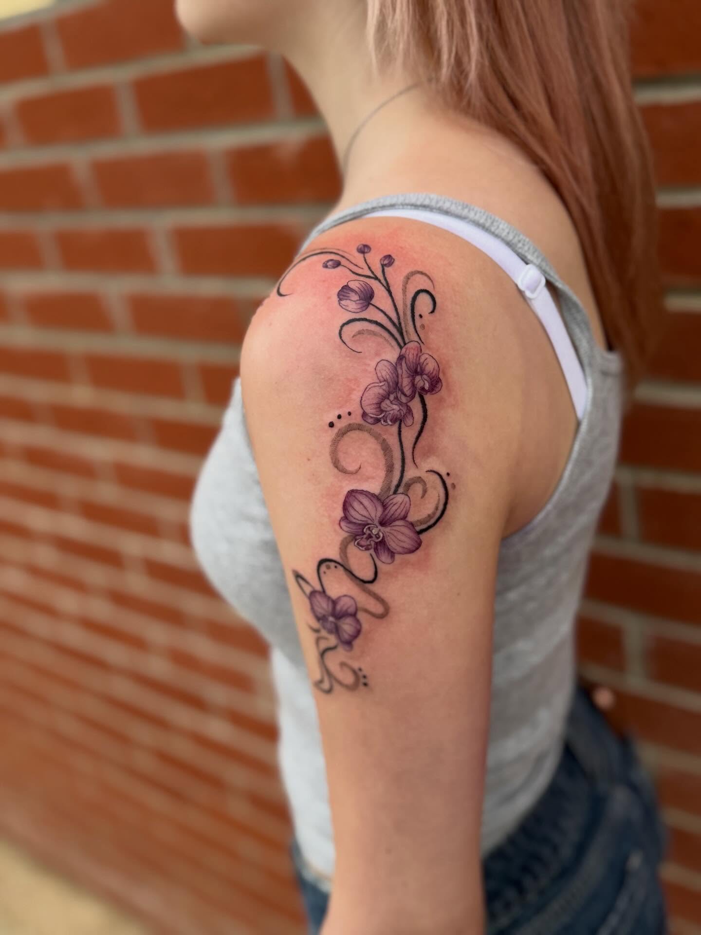 Orchids new school tattoo on the shoulder by Aly Rucker, Murfreesboro, Tennessee