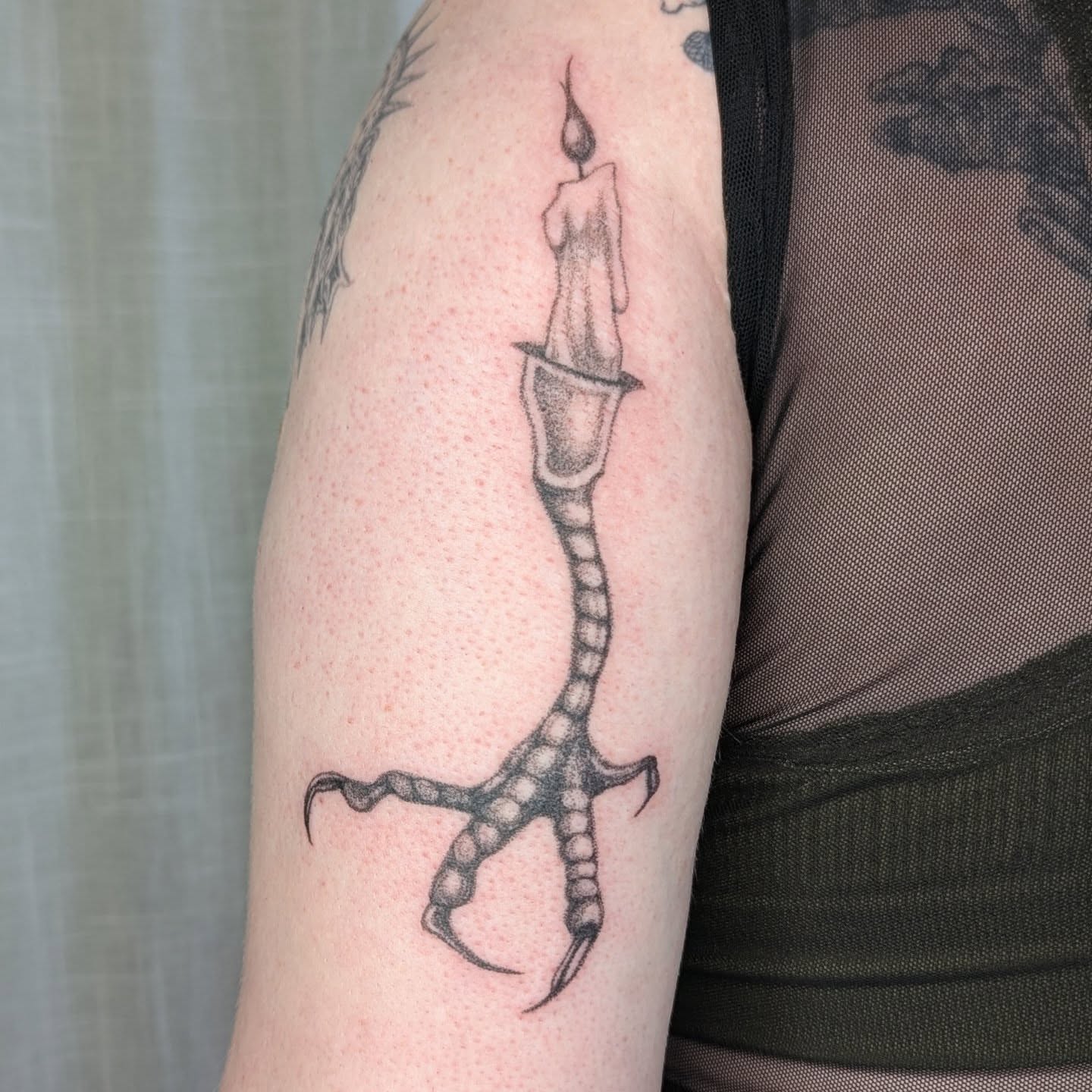 Candle and claw dotwork tattoo on the forearm by theo, Portland, Oregon