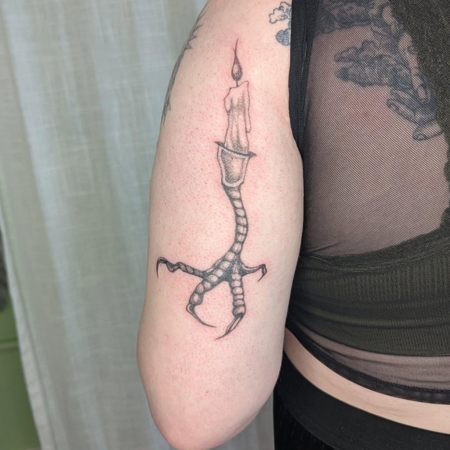 Candle with claw black and grey tattoo on the forearm by theo, Portland, Oregon