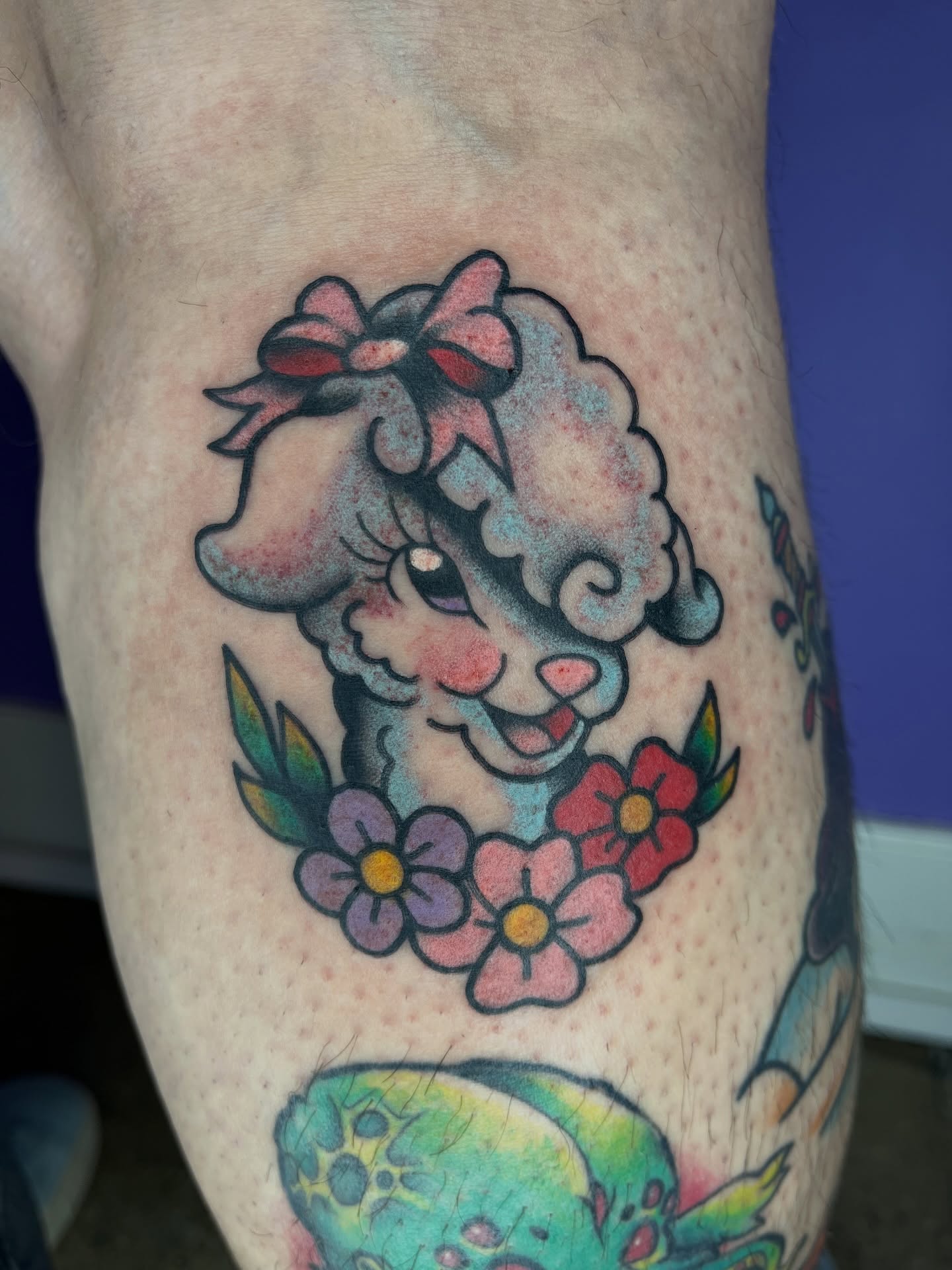 Sheep with bow new school tattoo on the thigh by Autumn**🍓NOW BOOKING