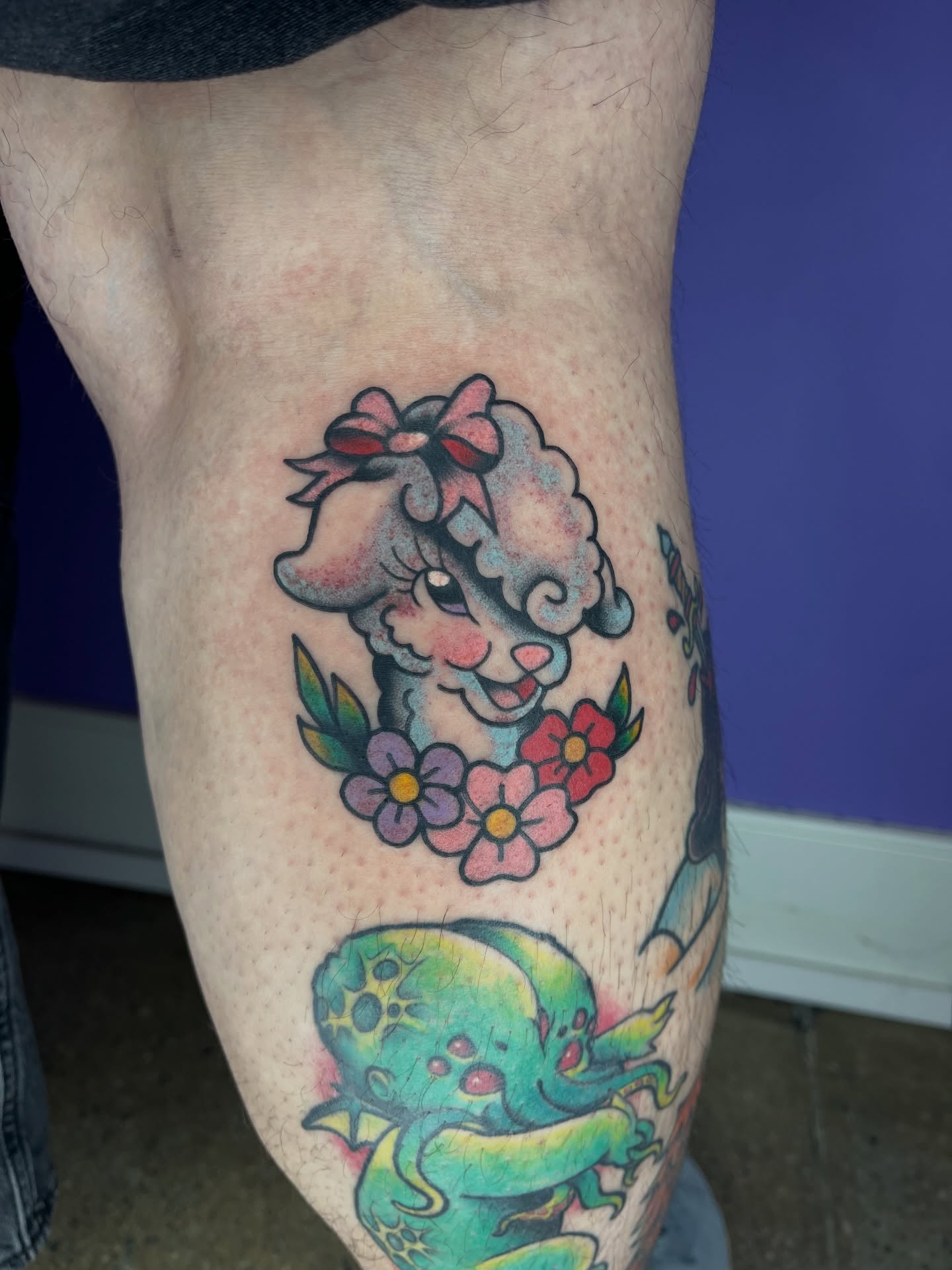 Sheep with flowers American traditional tattoo on the thigh by Autumn**🍓NOW BOOKING