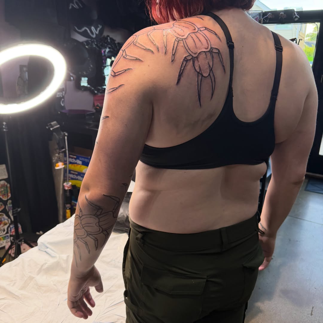 Crab black and grey tattoo on the shoulder by Mercy Dean