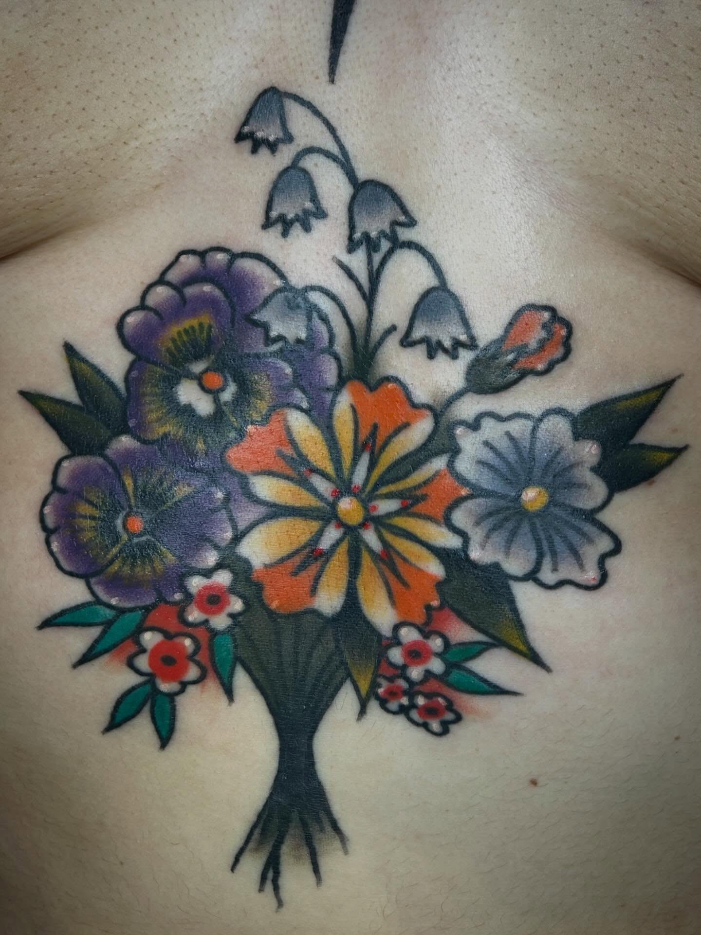 Floral bouquet American traditional tattoo on the chest by Morgan Hazer Tattoos, Cedar Rapids, Iowa