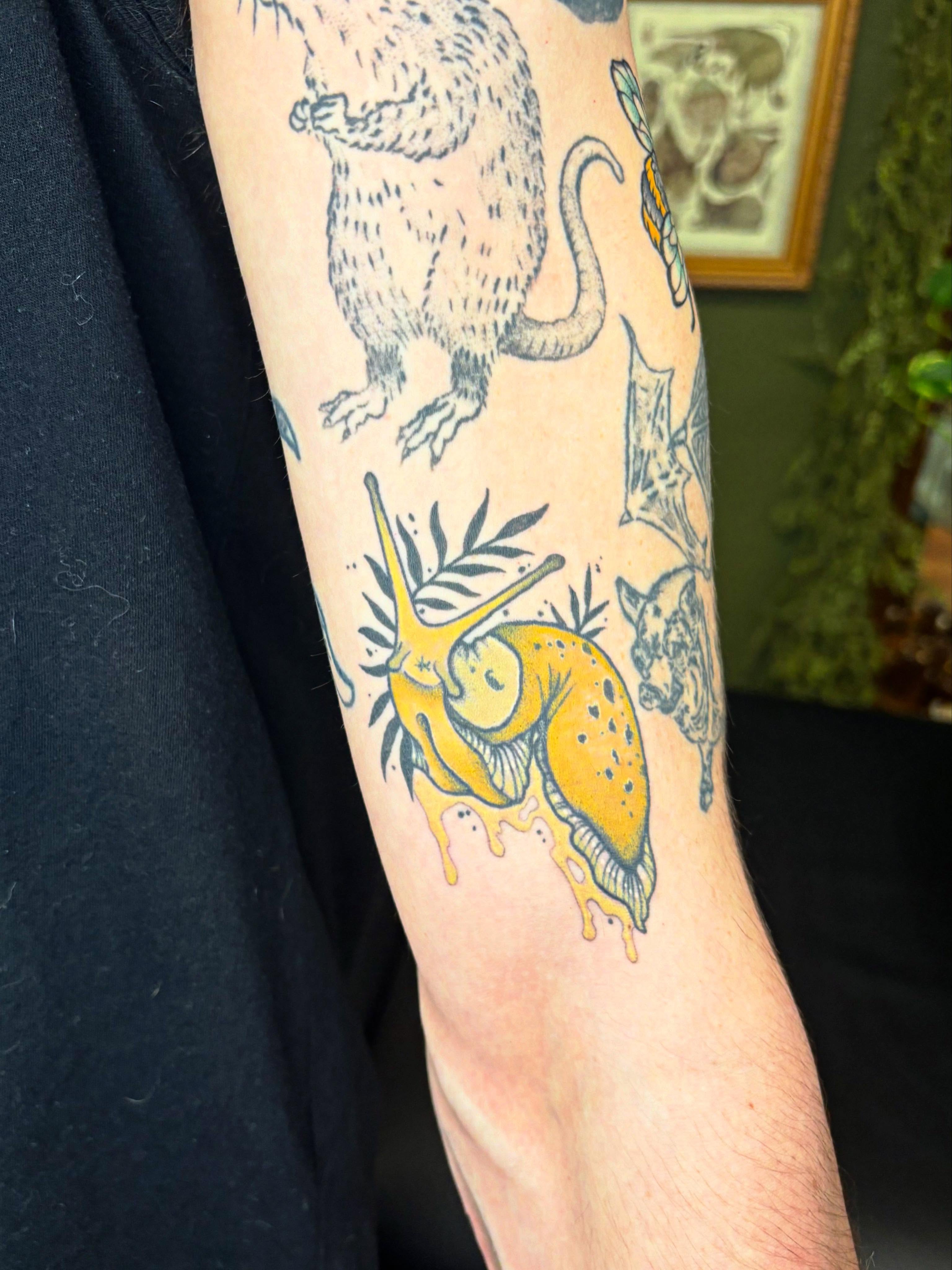 Snail and rat new school tattoo on the forearm by Wren Hollow, Portland, Oregon