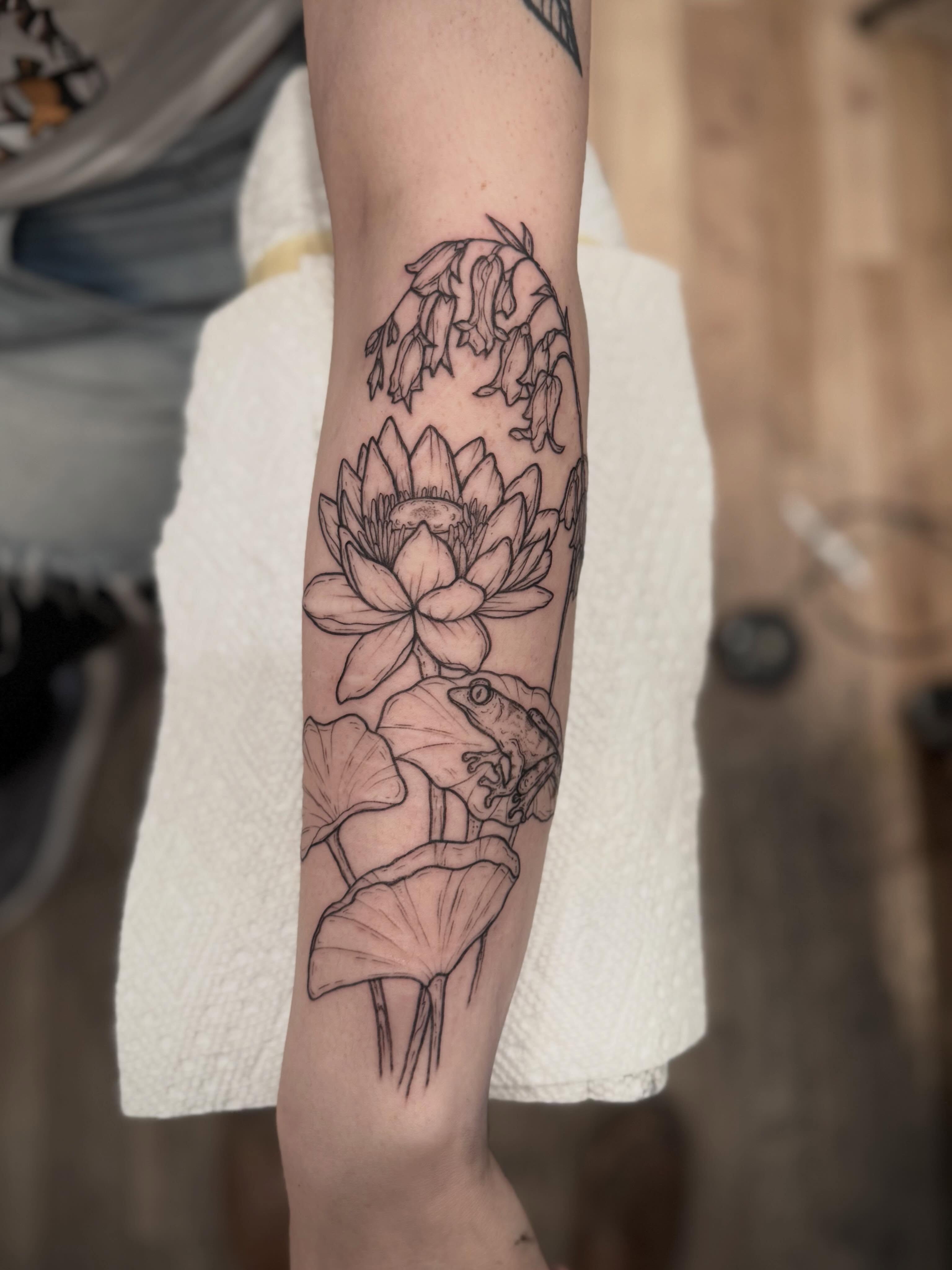 Lotus flower and frog realism tattoo on the forearm by Daniel Anthony, Philadelphia, Pennsylvania