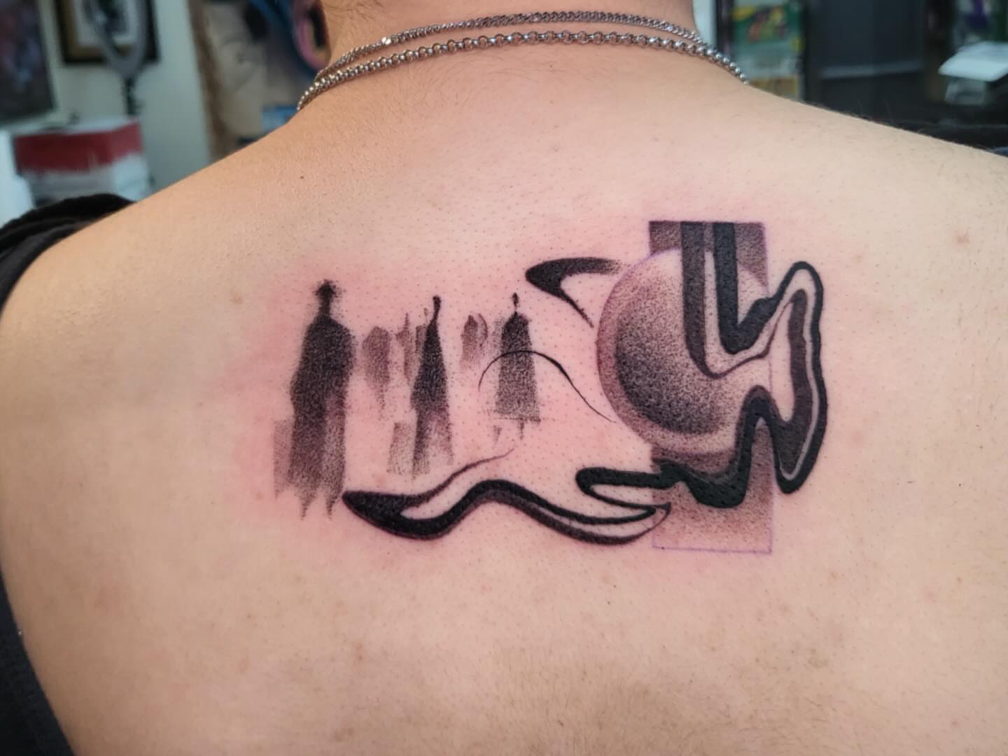 Abstract fish dotwork tattoo on the back by Brenda Juarez - Tattoo Artist