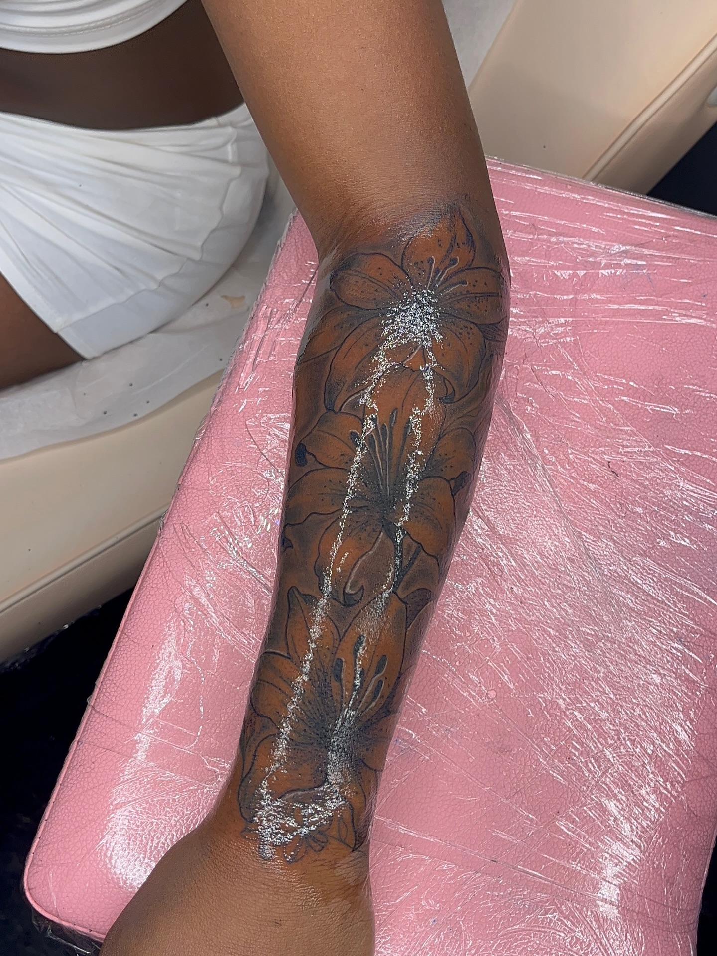 Floral design American traditional tattoo on the forearm by The inspo