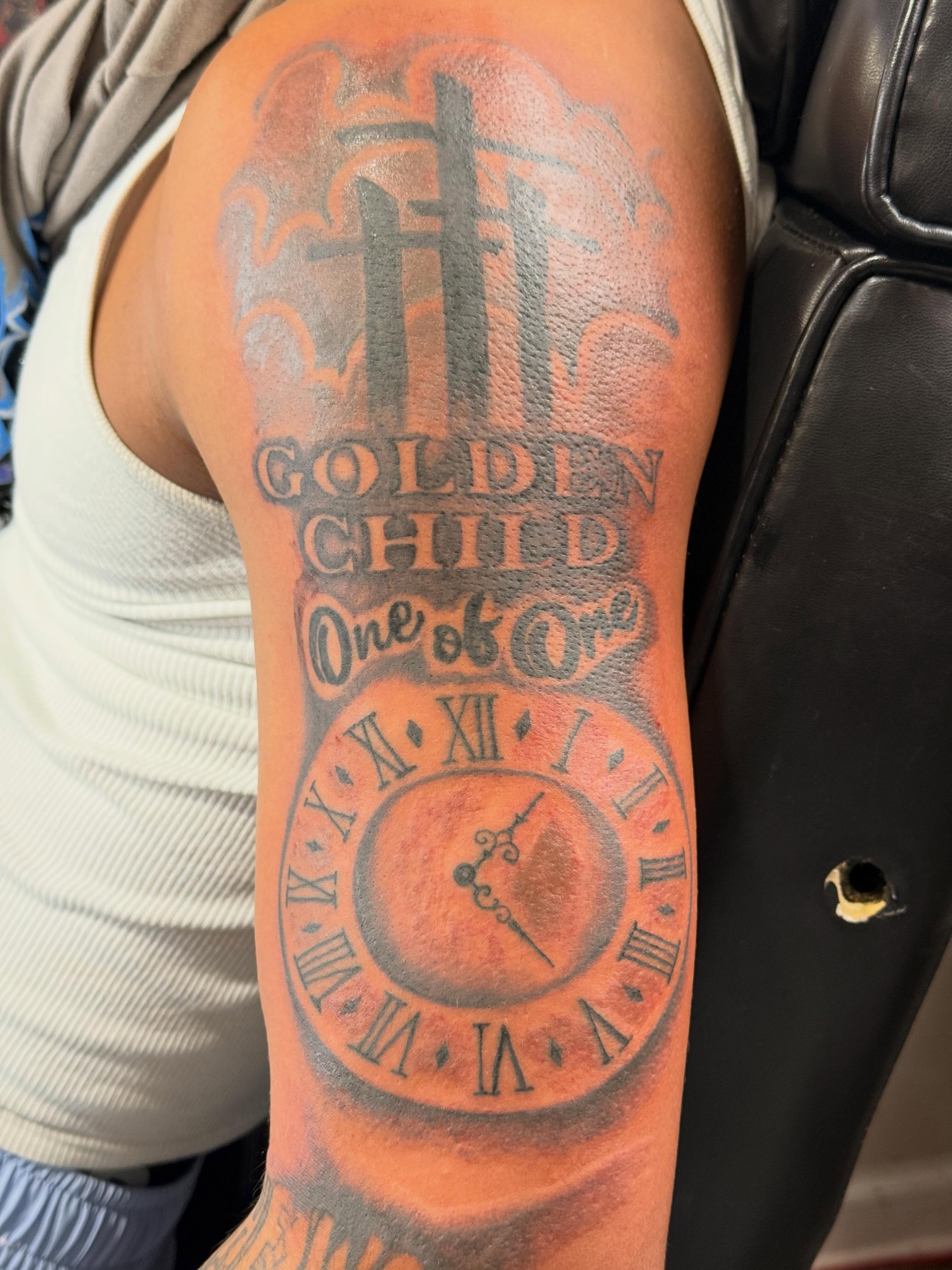 Clock and cross black and grey tattoo on the forearm by Jones Eric
