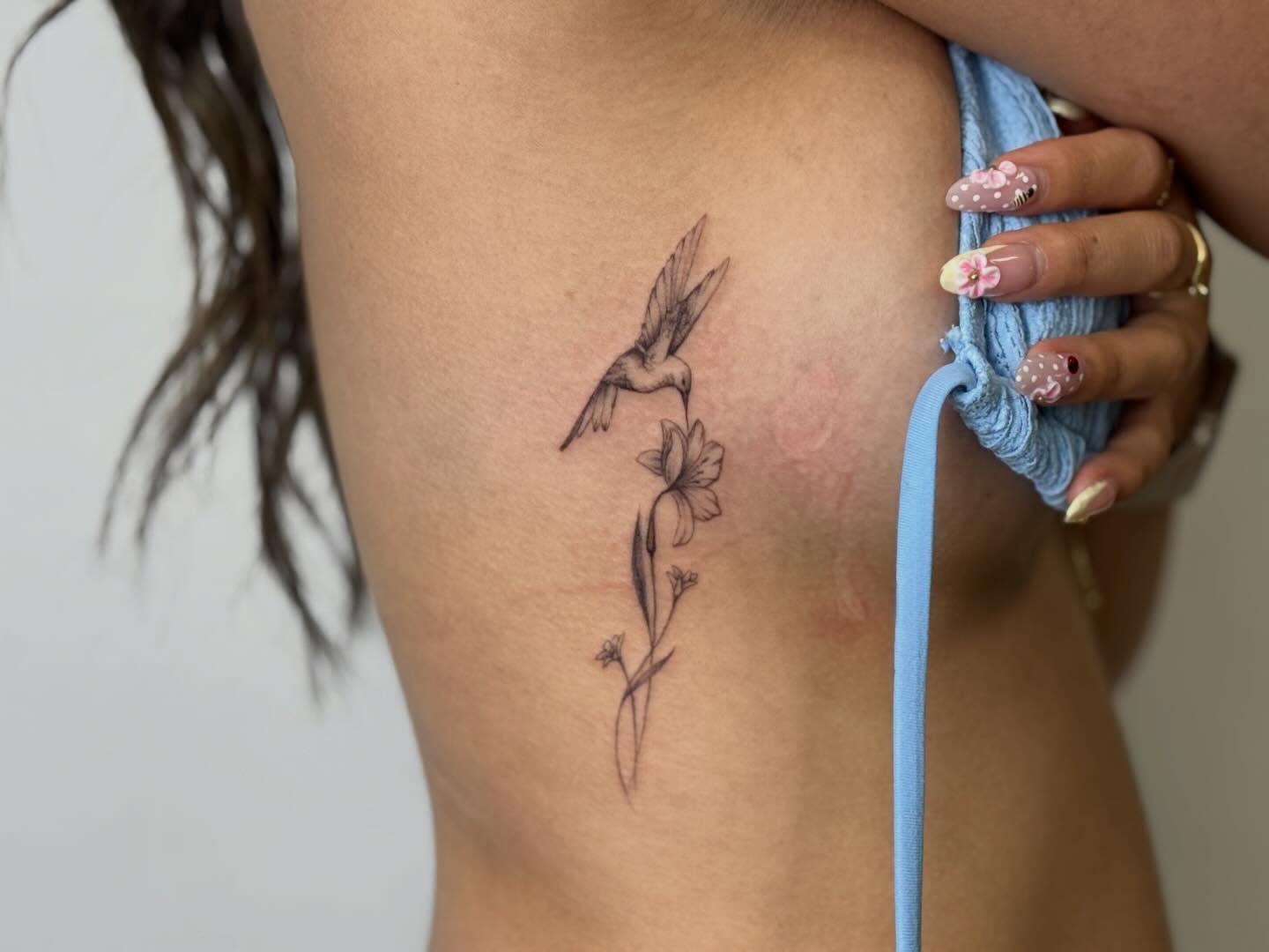 Bird and flower realism tattoo by Nevaeh tattoo artist