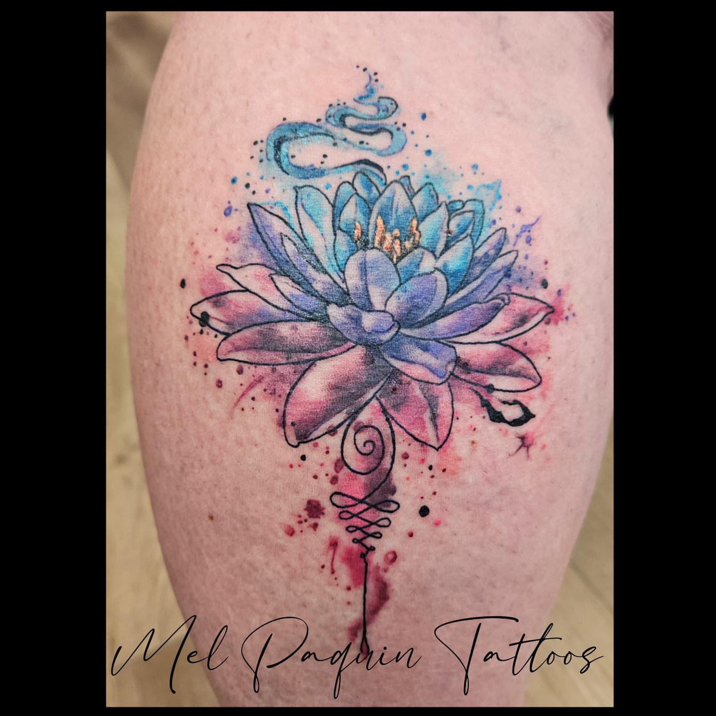 Lotus flower watercolor tattoo on the thigh by Mel Paquin