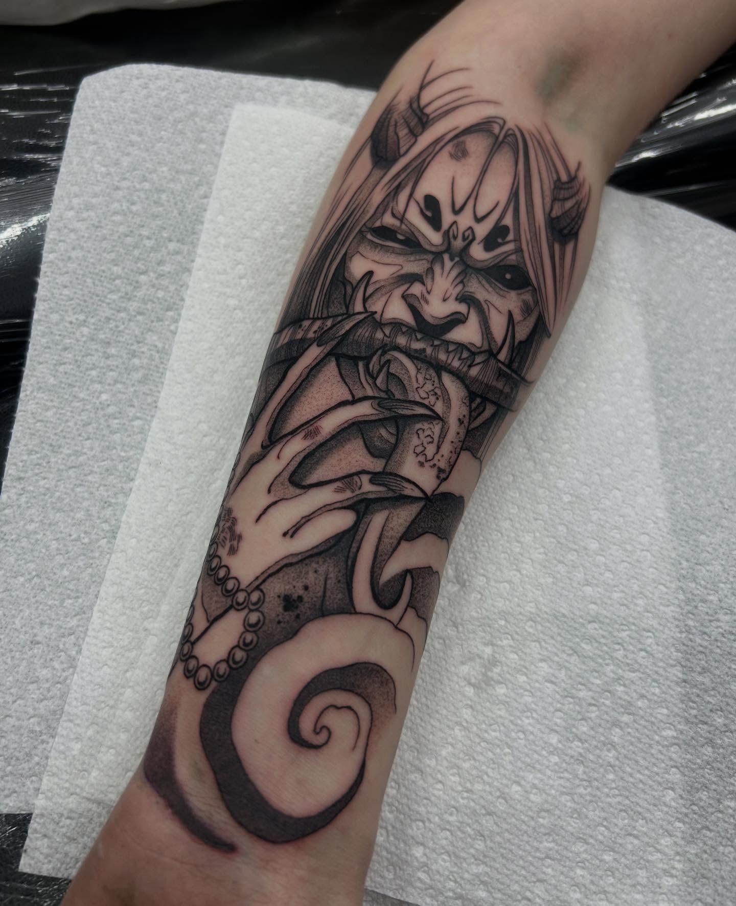 Orc-like creature dark realism tattoo on the forearm by Livy baby