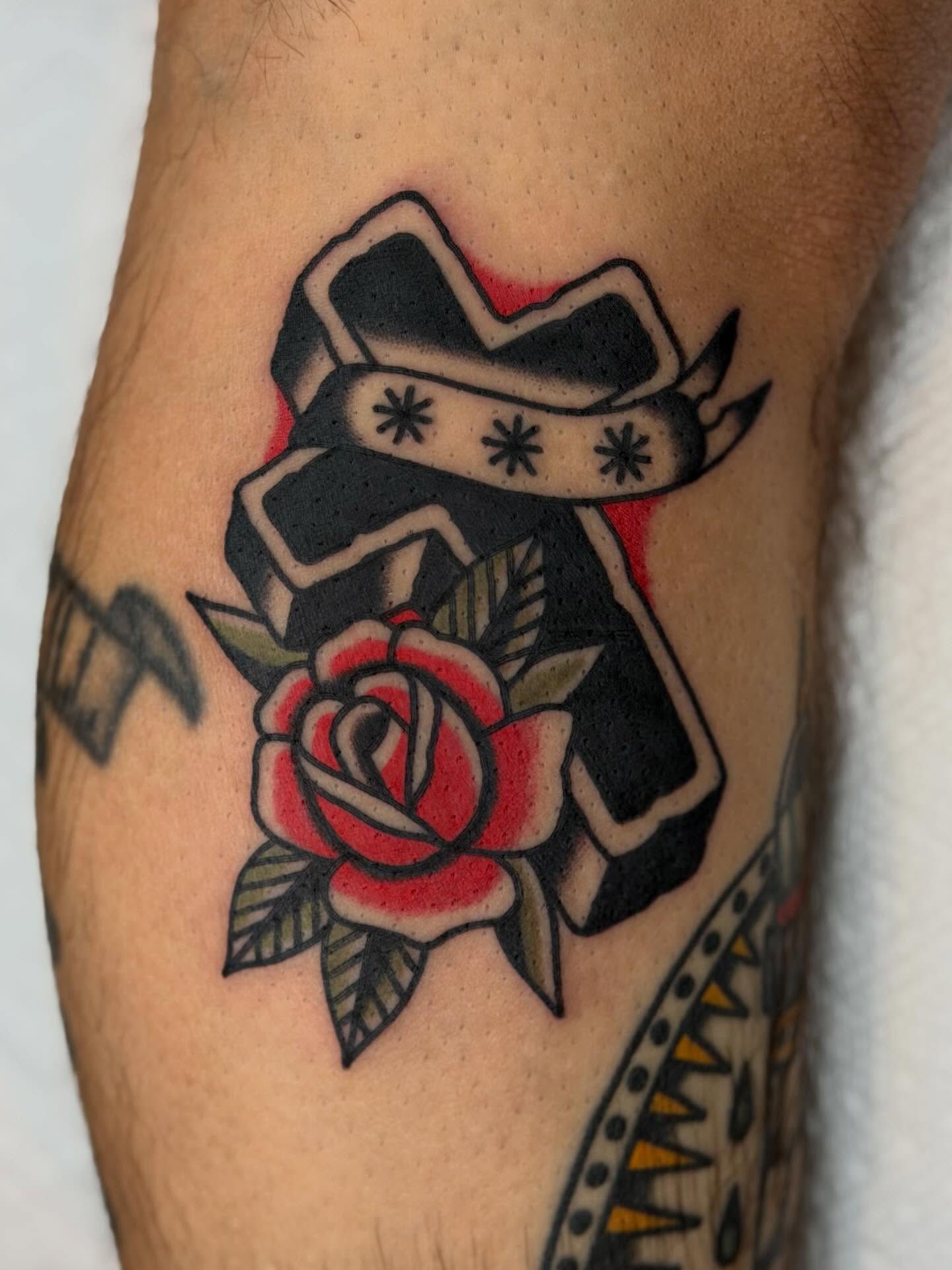 Cross and rose American traditional tattoo on the forearm by Blake Francis, Worcester, Massachusetts