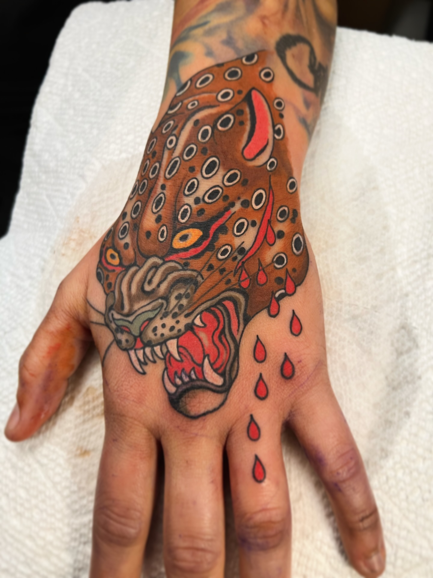 Panther dotwork tattoo on the hand by superteal