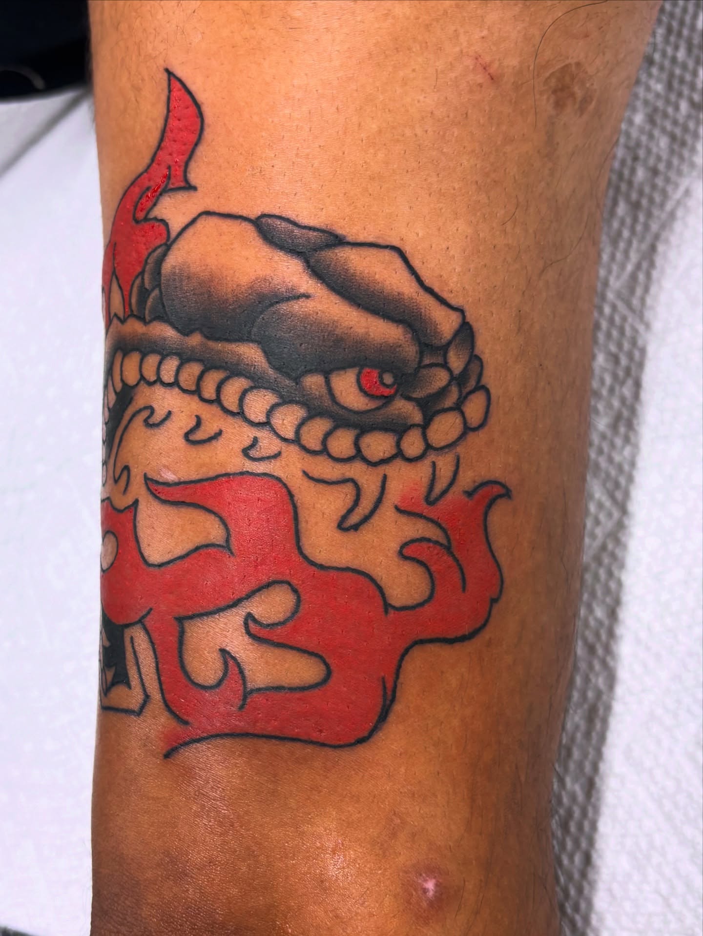 Dragon American traditional tattoo on the forearm by Gabe Rosen