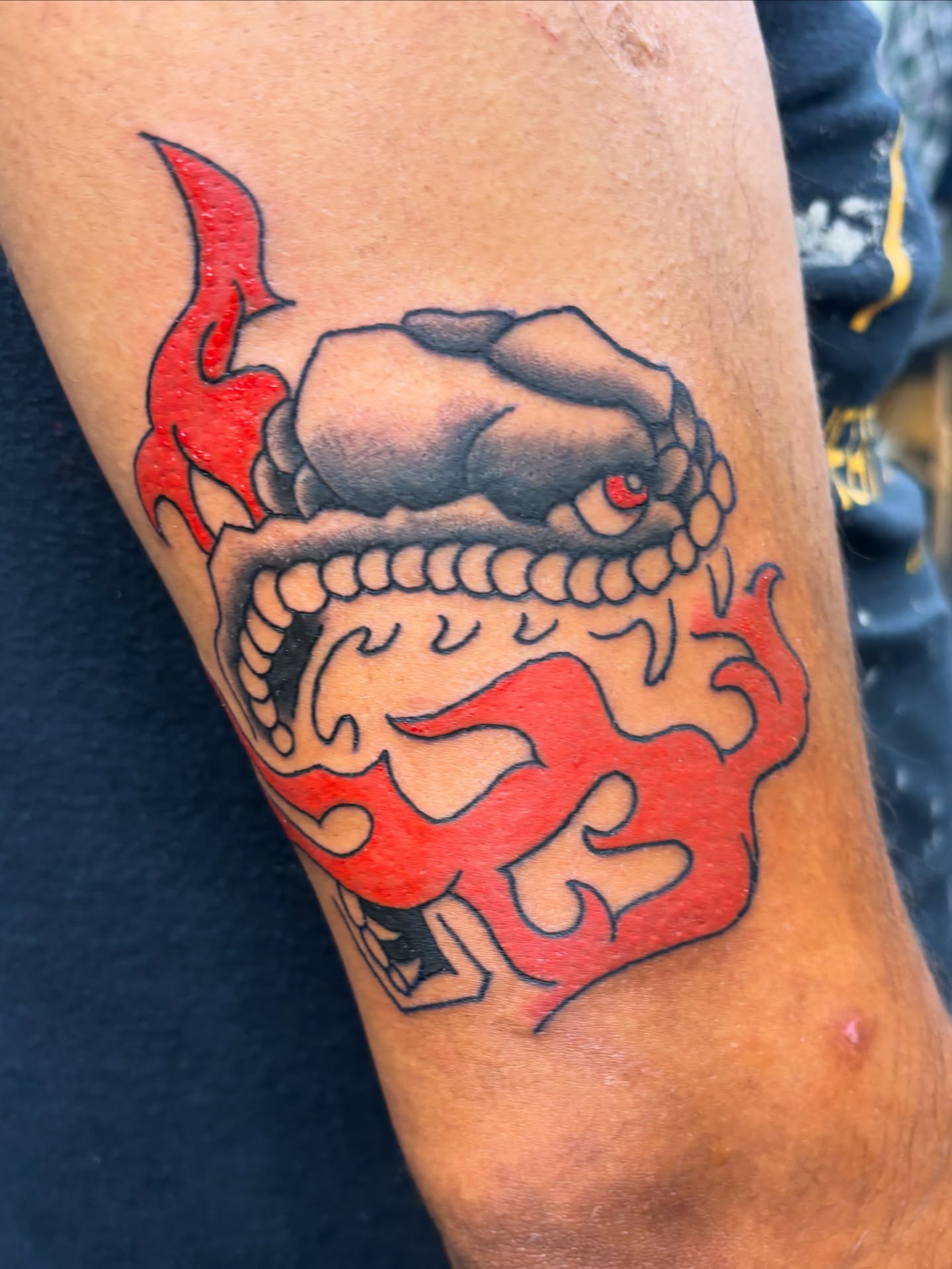 Demon head American traditional tattoo on the forearm by Gabe Rosen