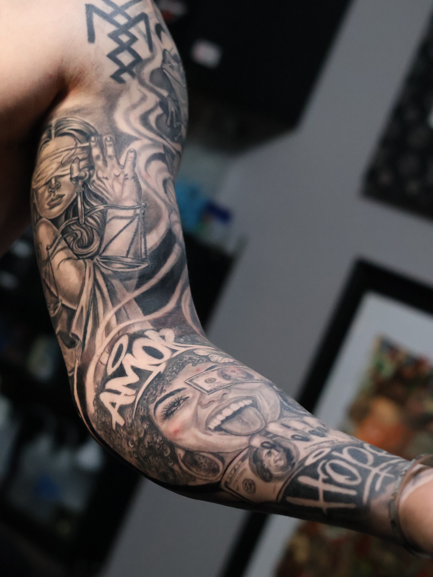 Woman with money realism tattoo on the forearm by German Patiño.