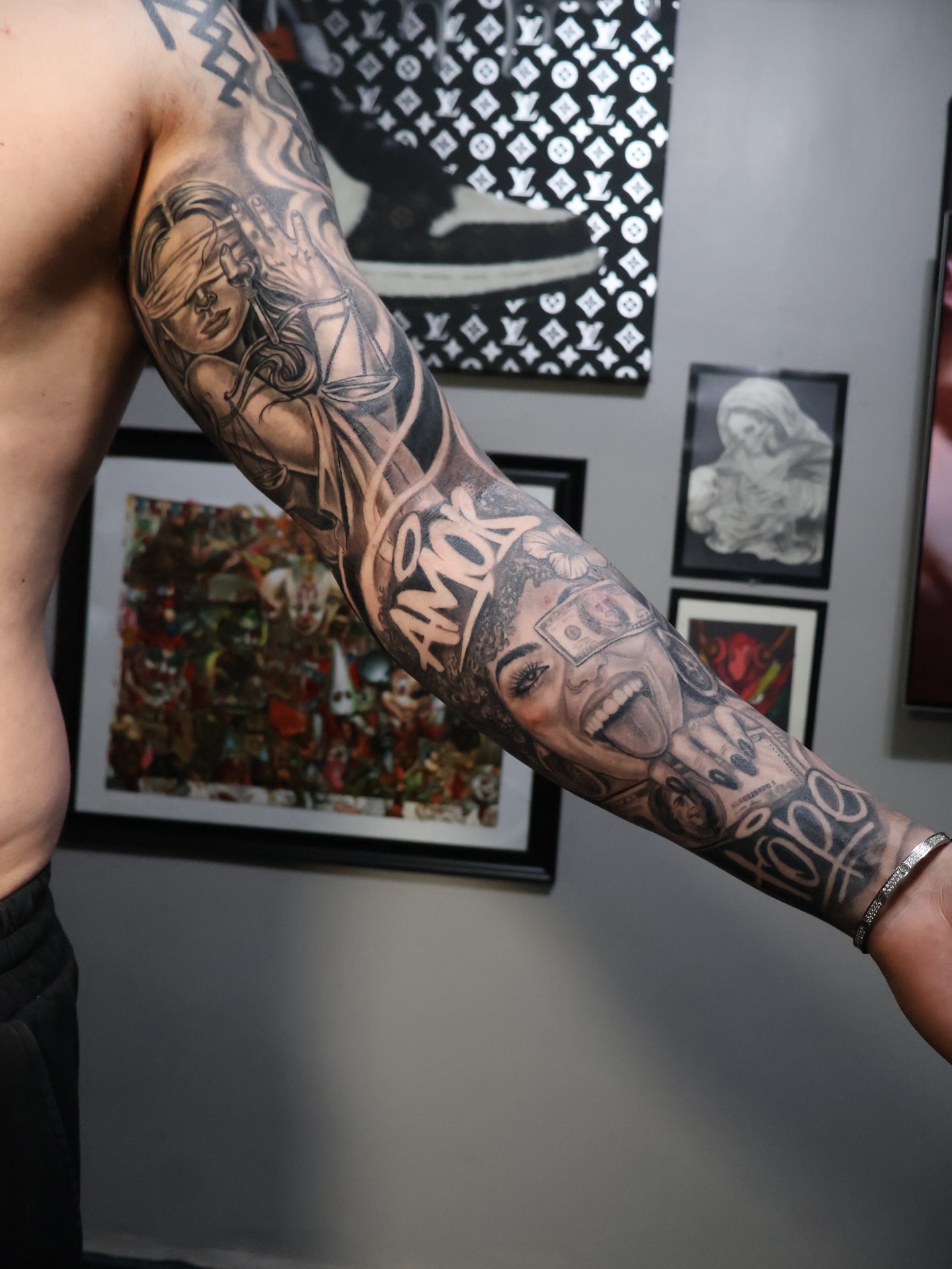 Woman with money realism tattoo on the forearm by German Patiño.