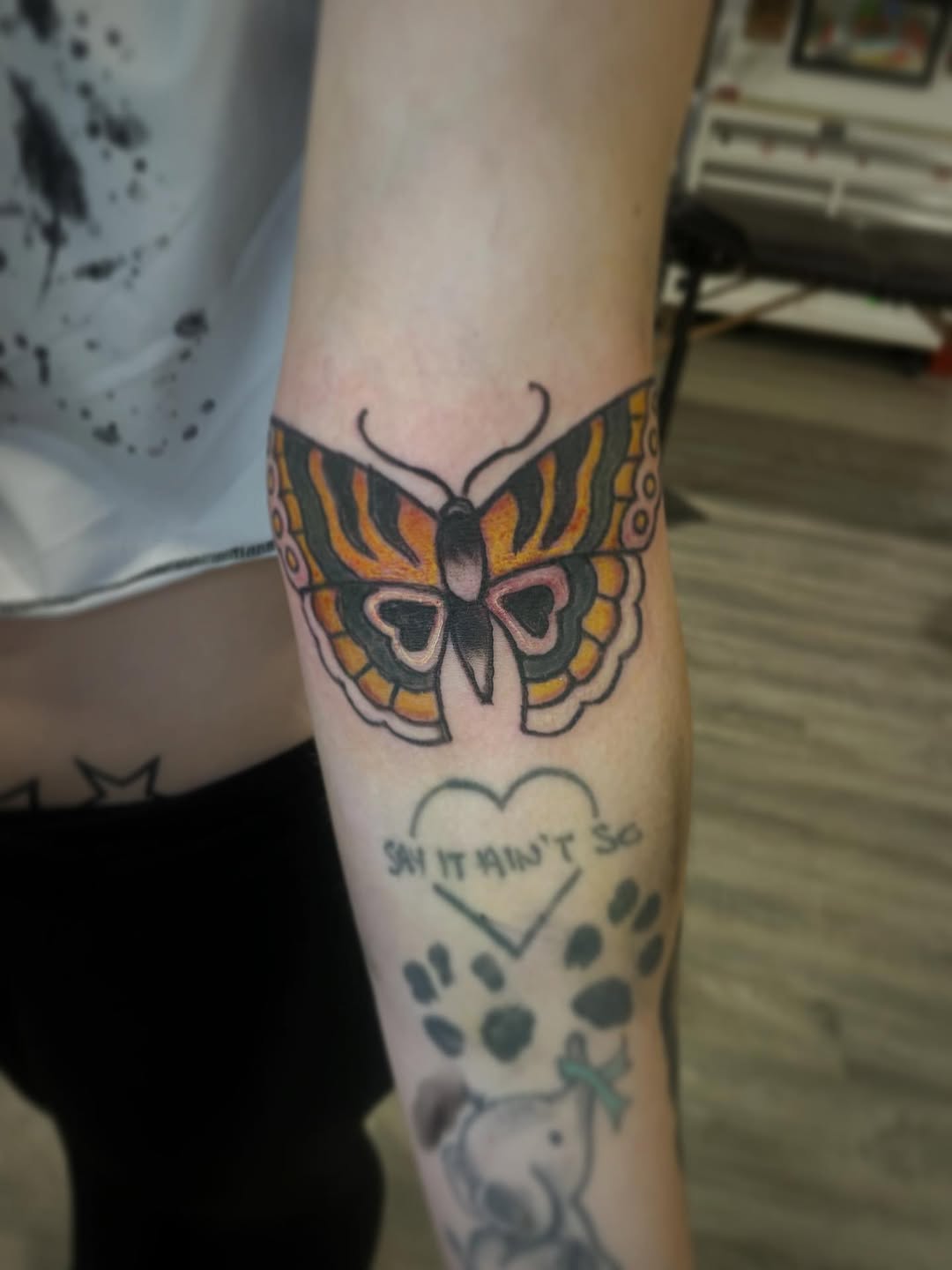 Butterfly fine line tattoo on the forearm by Logan Casimir