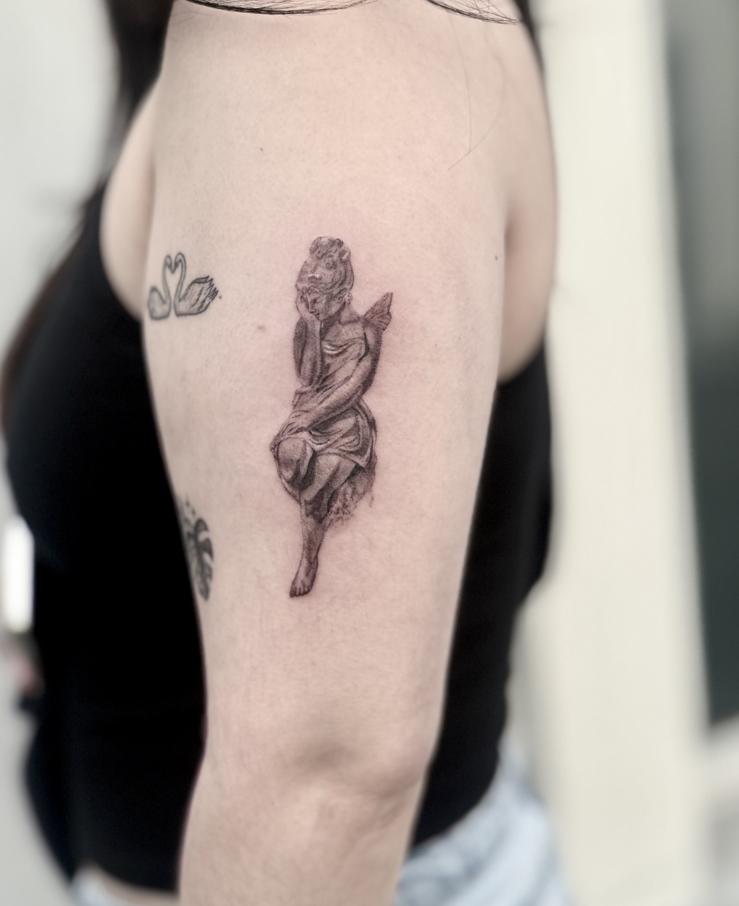 Statue of a woman realism tattoo on the forearm by Raleigh tattoo artist, Raleigh, North Carolina