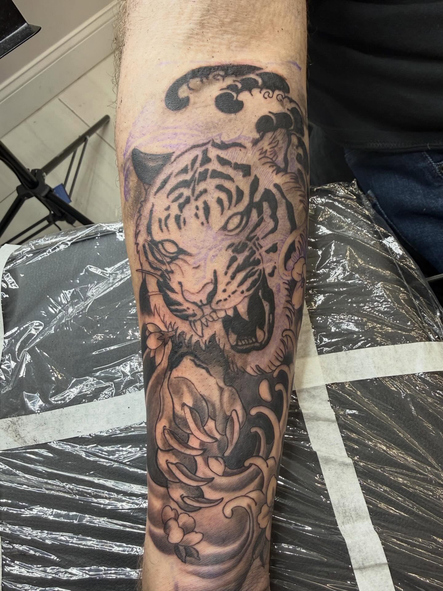 Tiger black and grey tattoo on the forearm by Kai, Charlotte, North Carolina