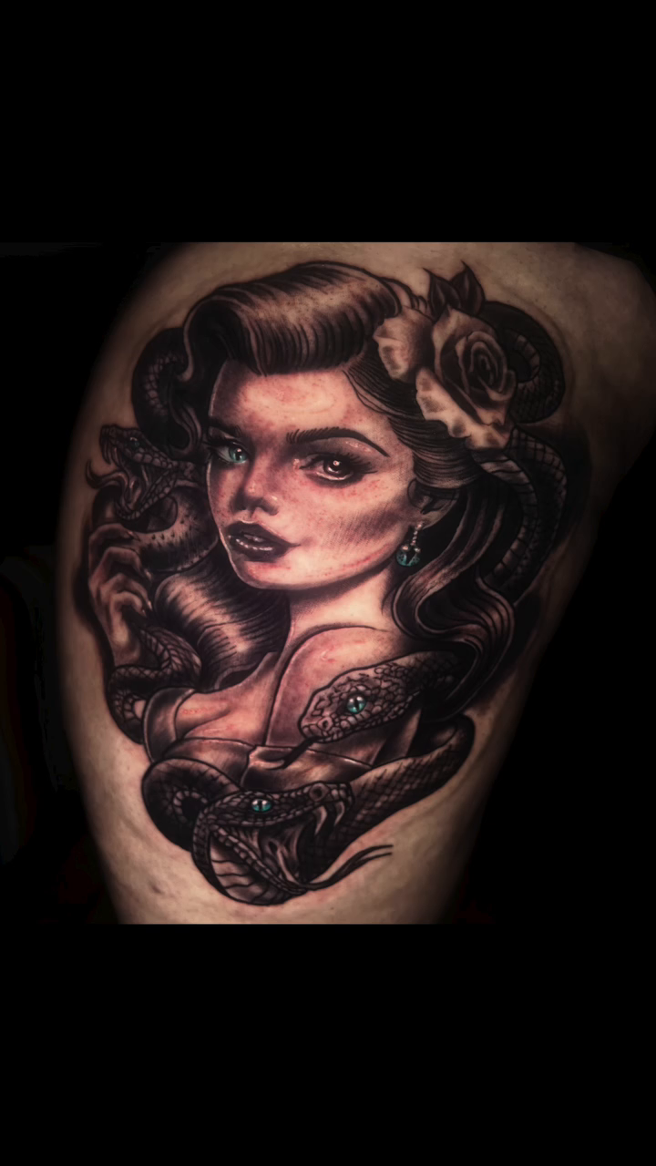 Woman with snake realism tattoo by Monstro Ink Arts Tattoos, Bakersfield, California