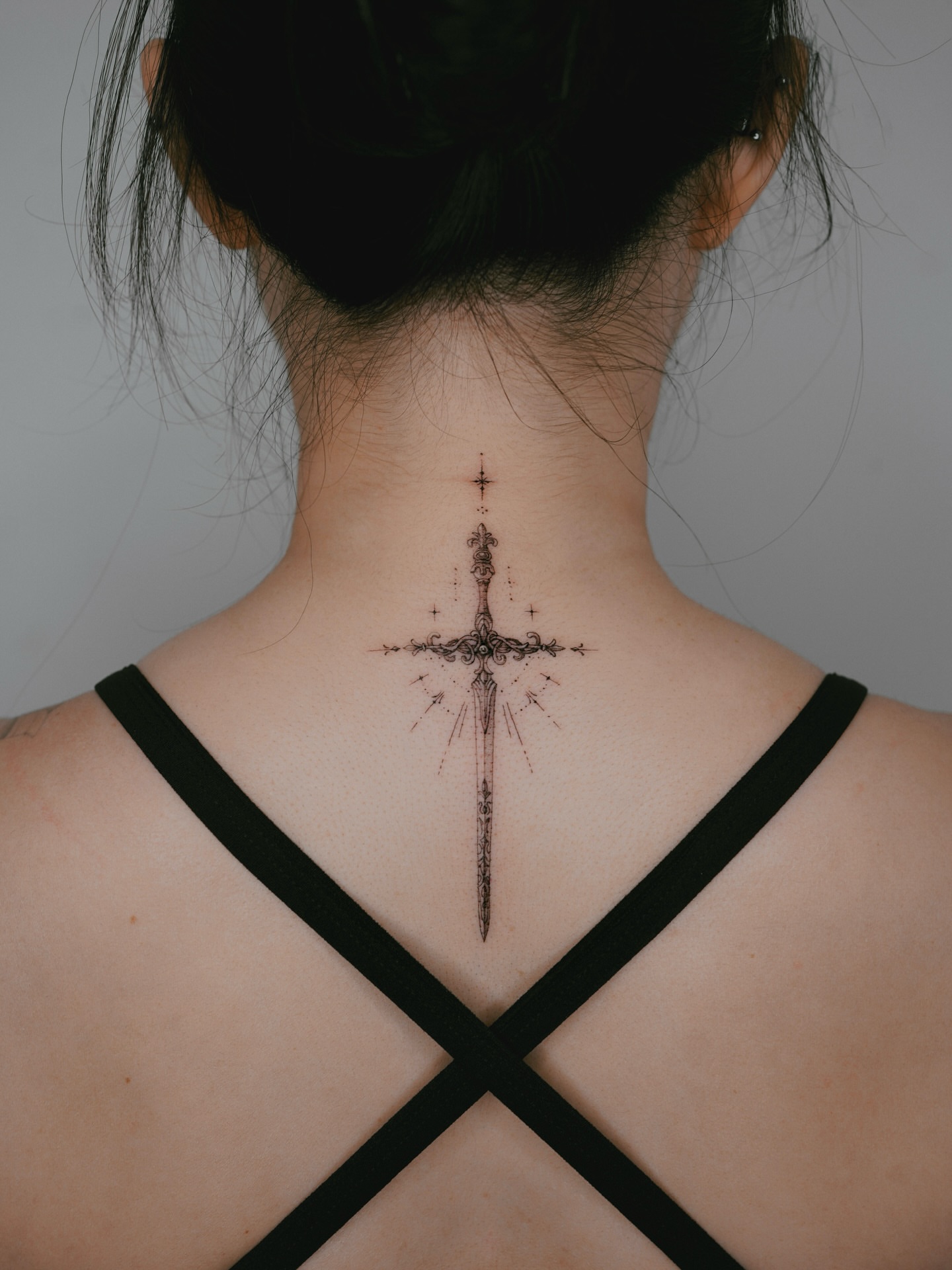 Sword black and grey tattoo on the neck by Yeonji