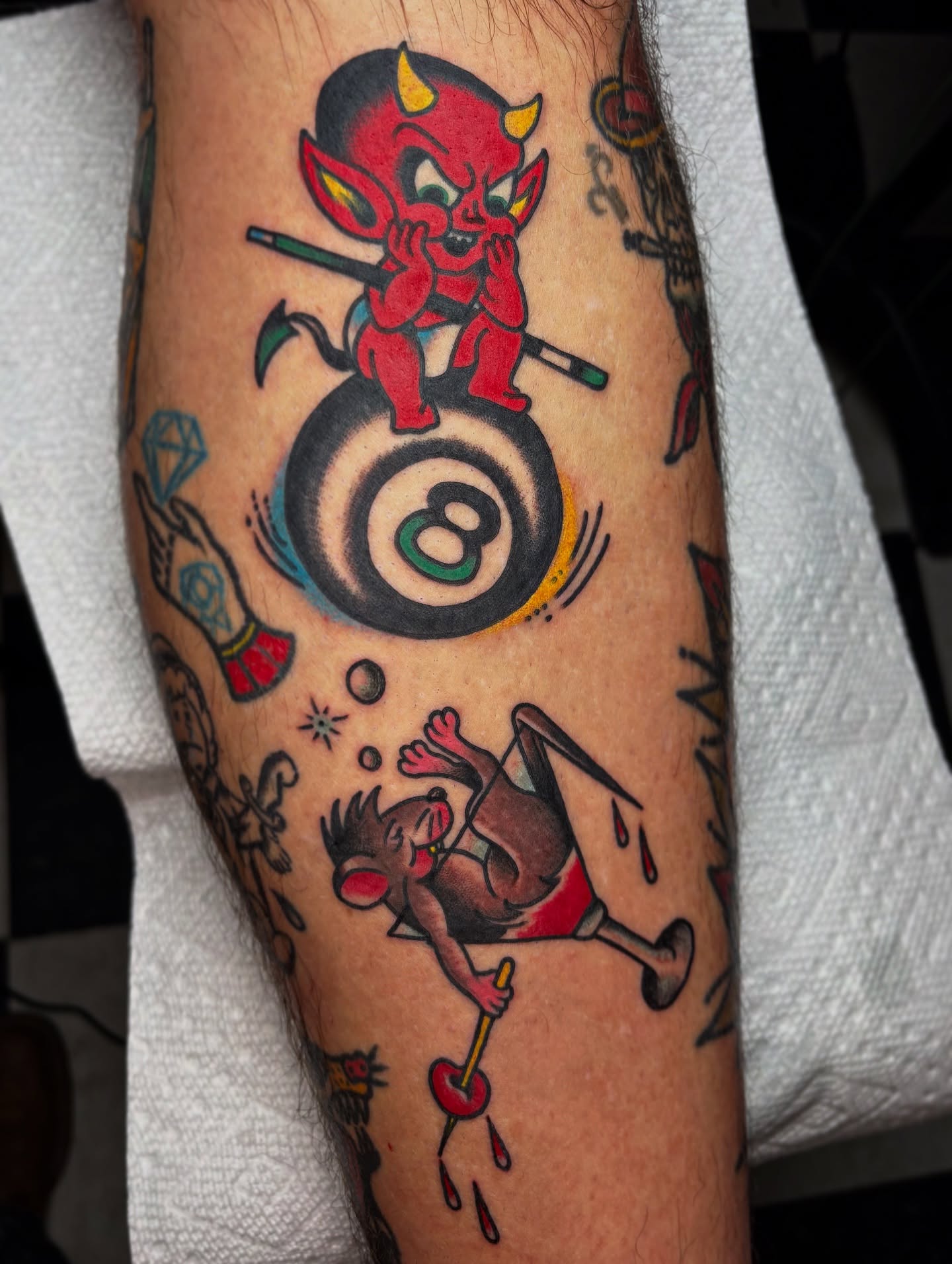 Devil and monkey American traditional tattoo on the forearm by Mitch McGarry