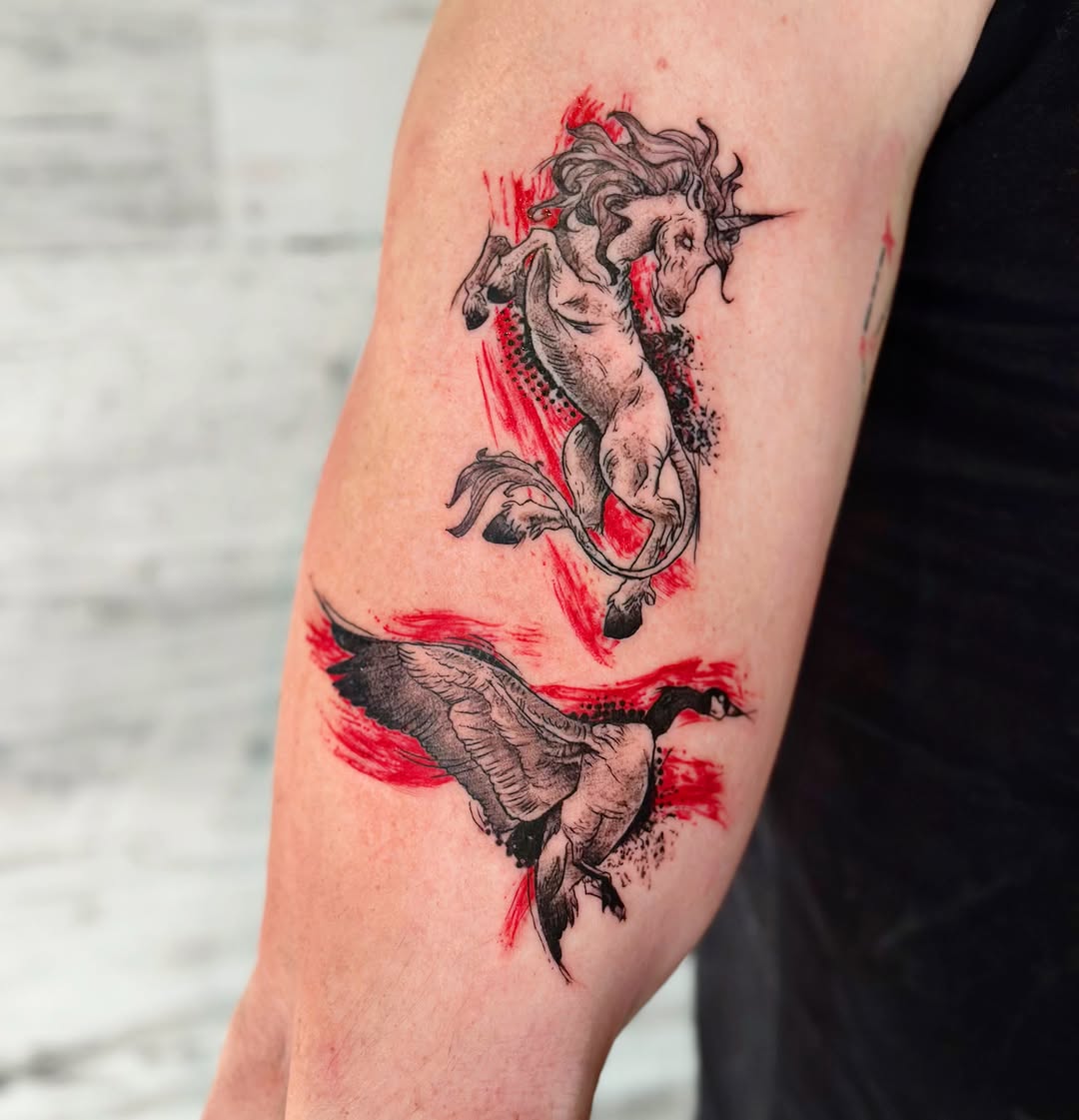 Unicorn and goose watercolor tattoo on the forearm by Lex