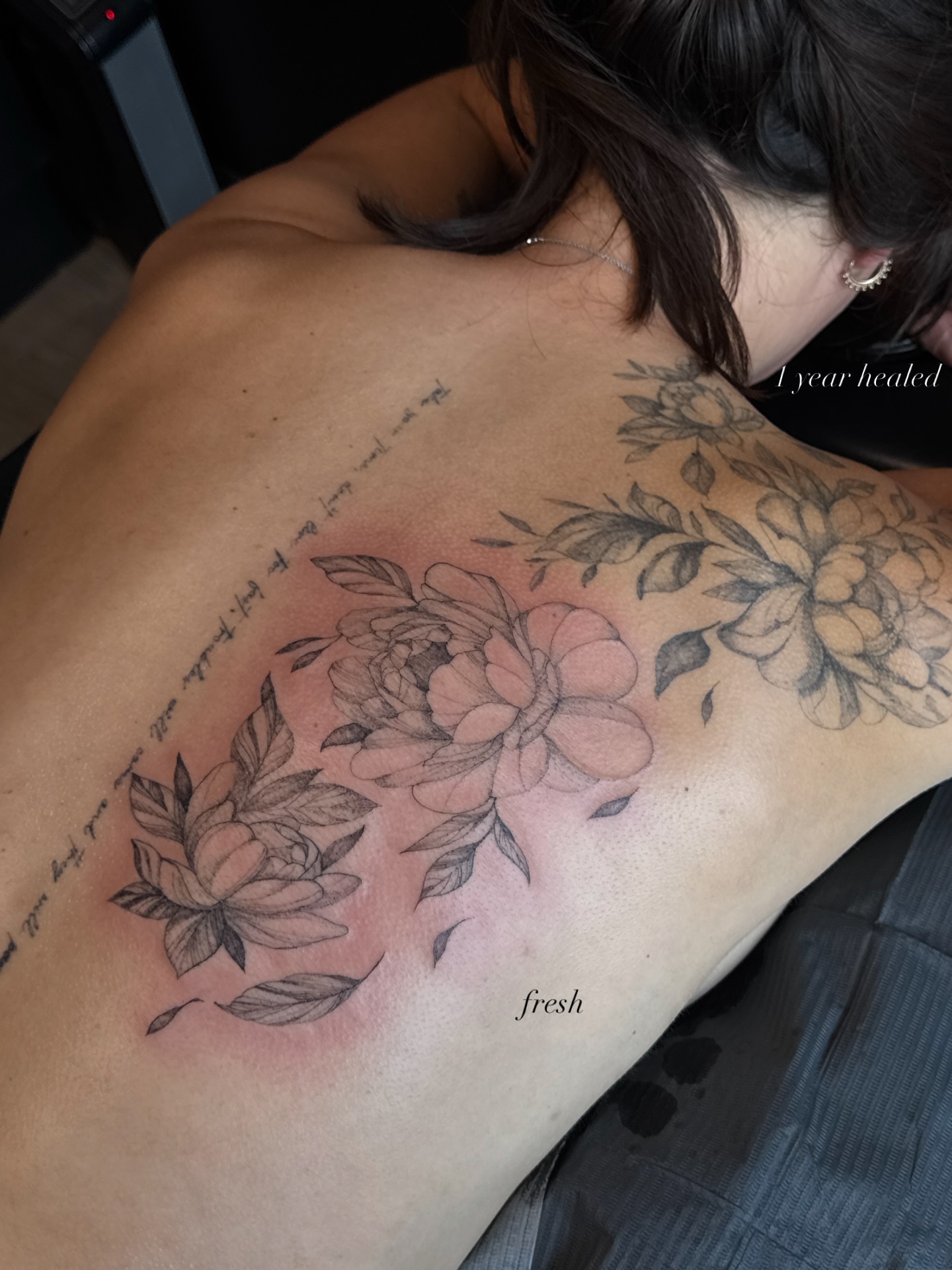 Floral arrangement black and grey tattoo on the back by Ryleigh Benjamin