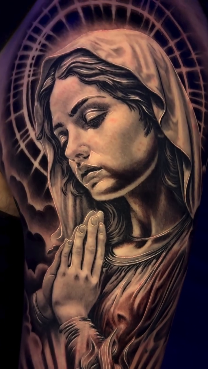 Virgin Mary with Sacred Heart Chicano tattoo on the upper arm by Raw Hound, Hialeah, Florida