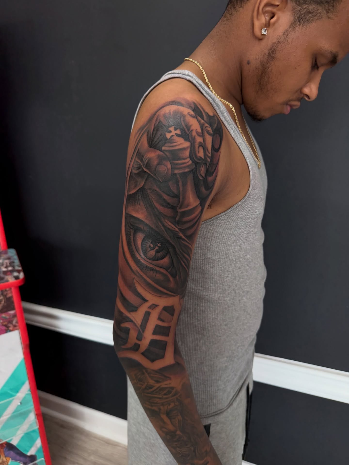 Eye and hand realism tattoo on the upper arm by Michigan📍 Day Sessions $850, Wayne, Michigan