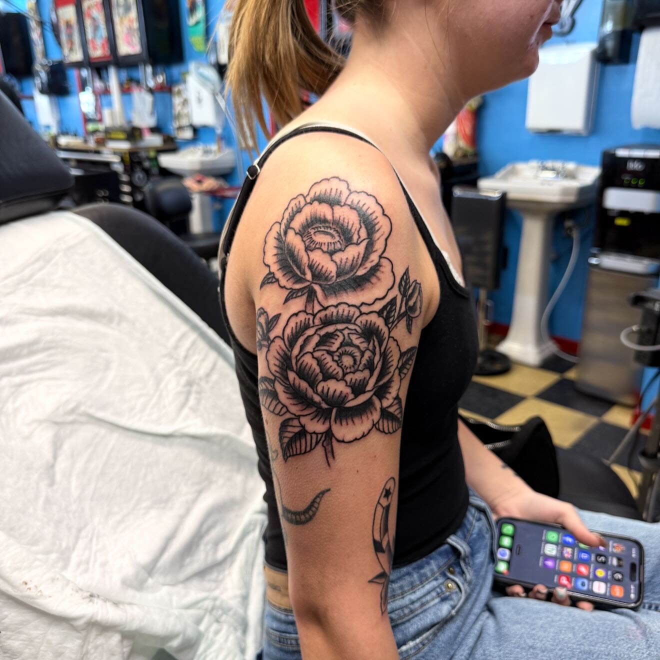 Roses American traditional tattoo on the forearm by Gary Chase