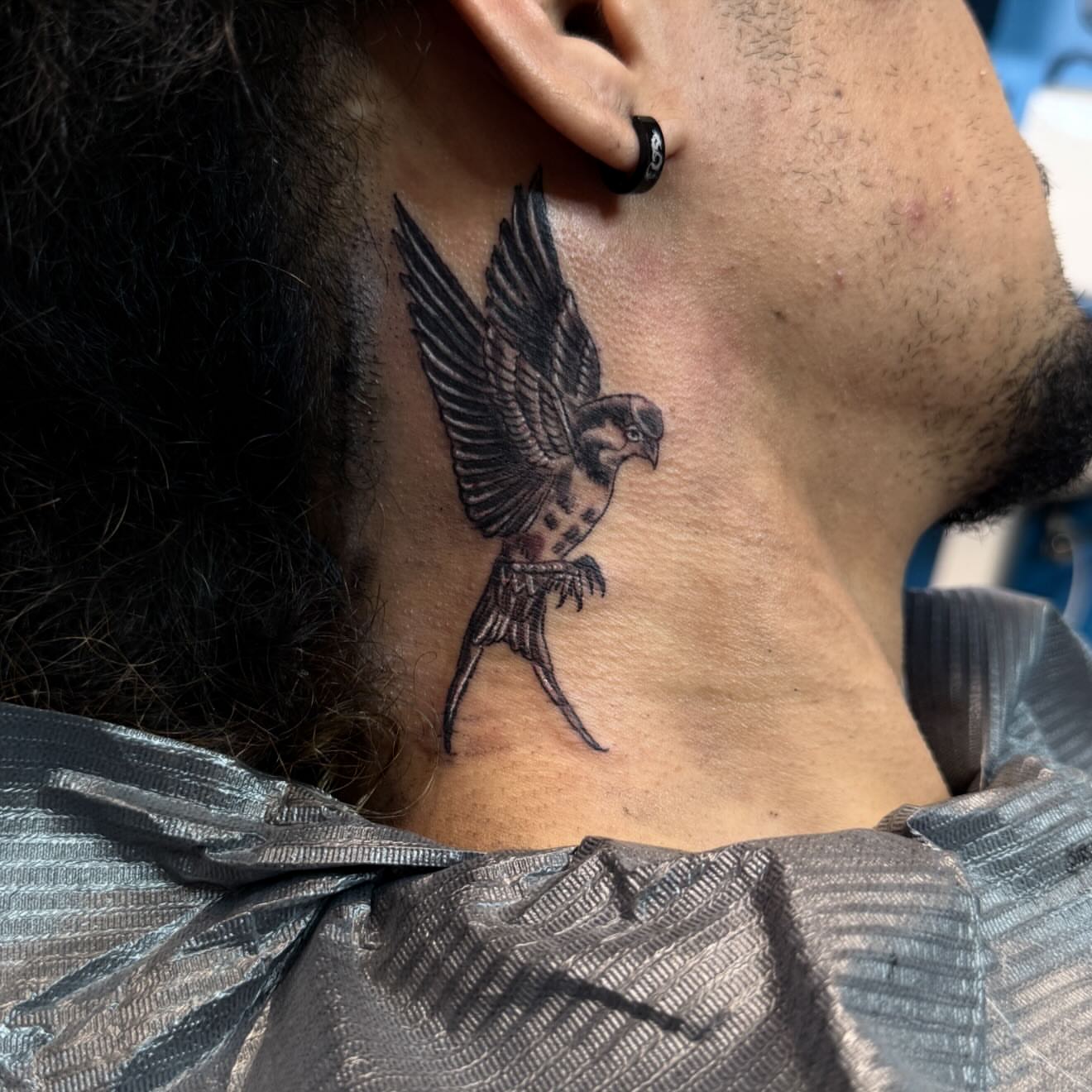 Sparrow black and grey tattoo on the neck by Gary Chase