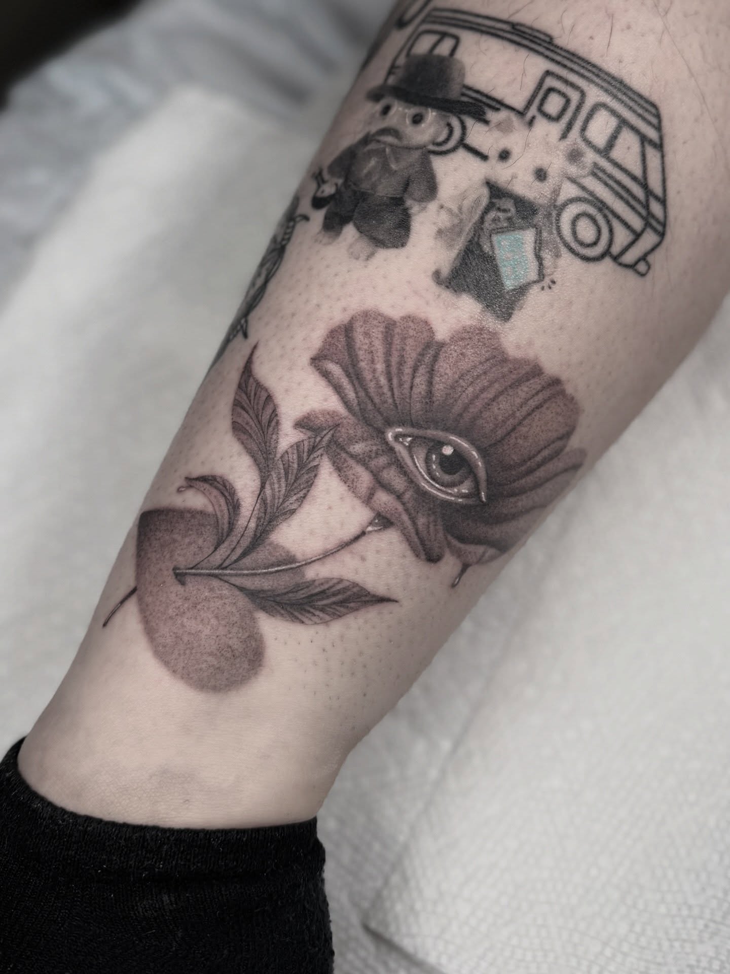 Flower with eye dotwork tattoo on the forearm by Mara Flores βπΛβ§